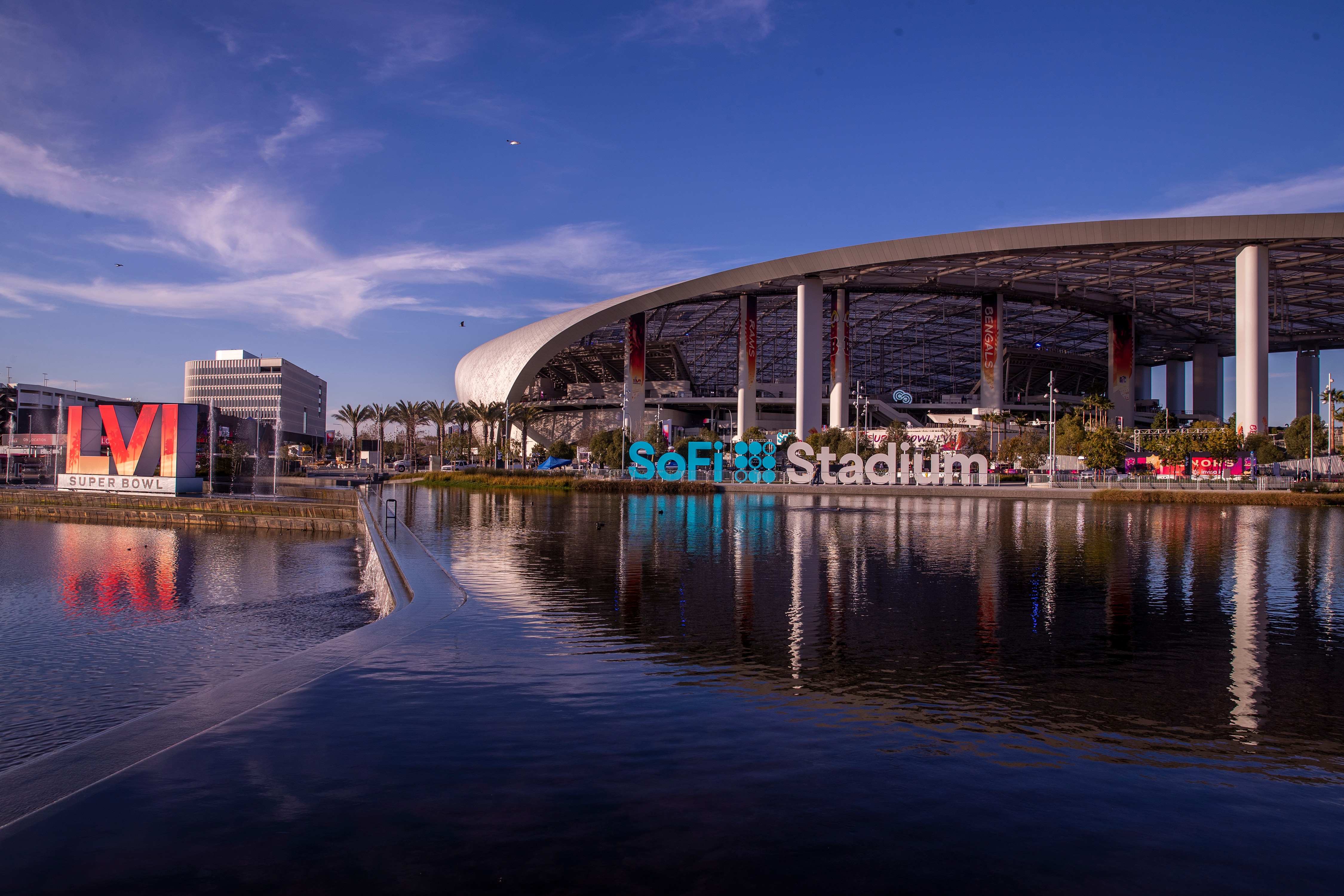 Los Angeles, CA - February 09: Workers make last minute preparations for the Super Bowl as viewed from the lake at SoFi Stadium in Los Angeles Wednesday, Feb. 9, 2022. (Allen J. Schaben / Los Angeles Times via Getty Images)