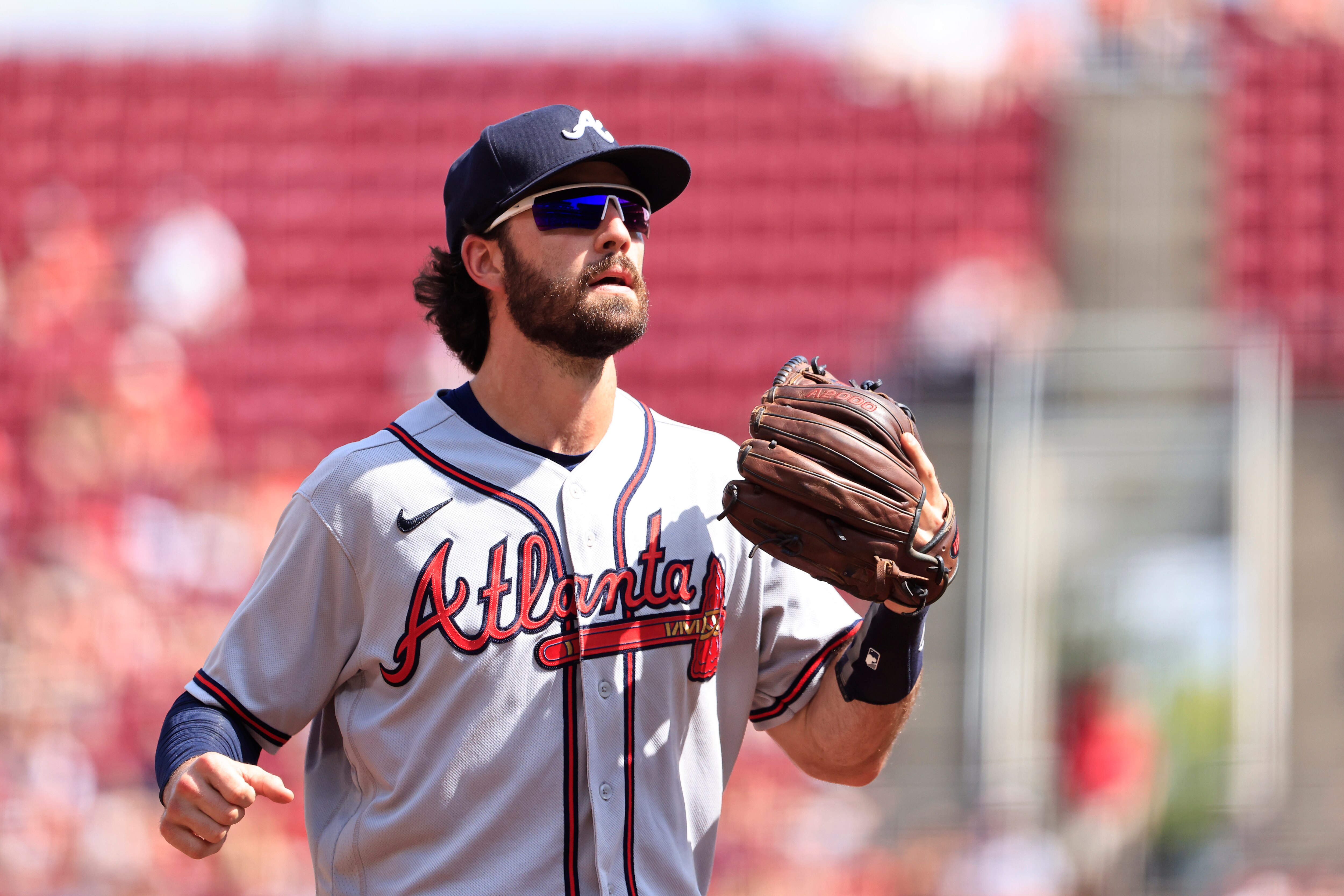CINCINNATI, OHIO - JULY 02: Dansby Swanson #7 of the Atlanta Braves walks onto the field in the game against the Cincinnati Reds at Great American Ball Park on July 02, 2022 in Cincinnati, Ohio. (Photo by Justin Casterline/Getty Images)