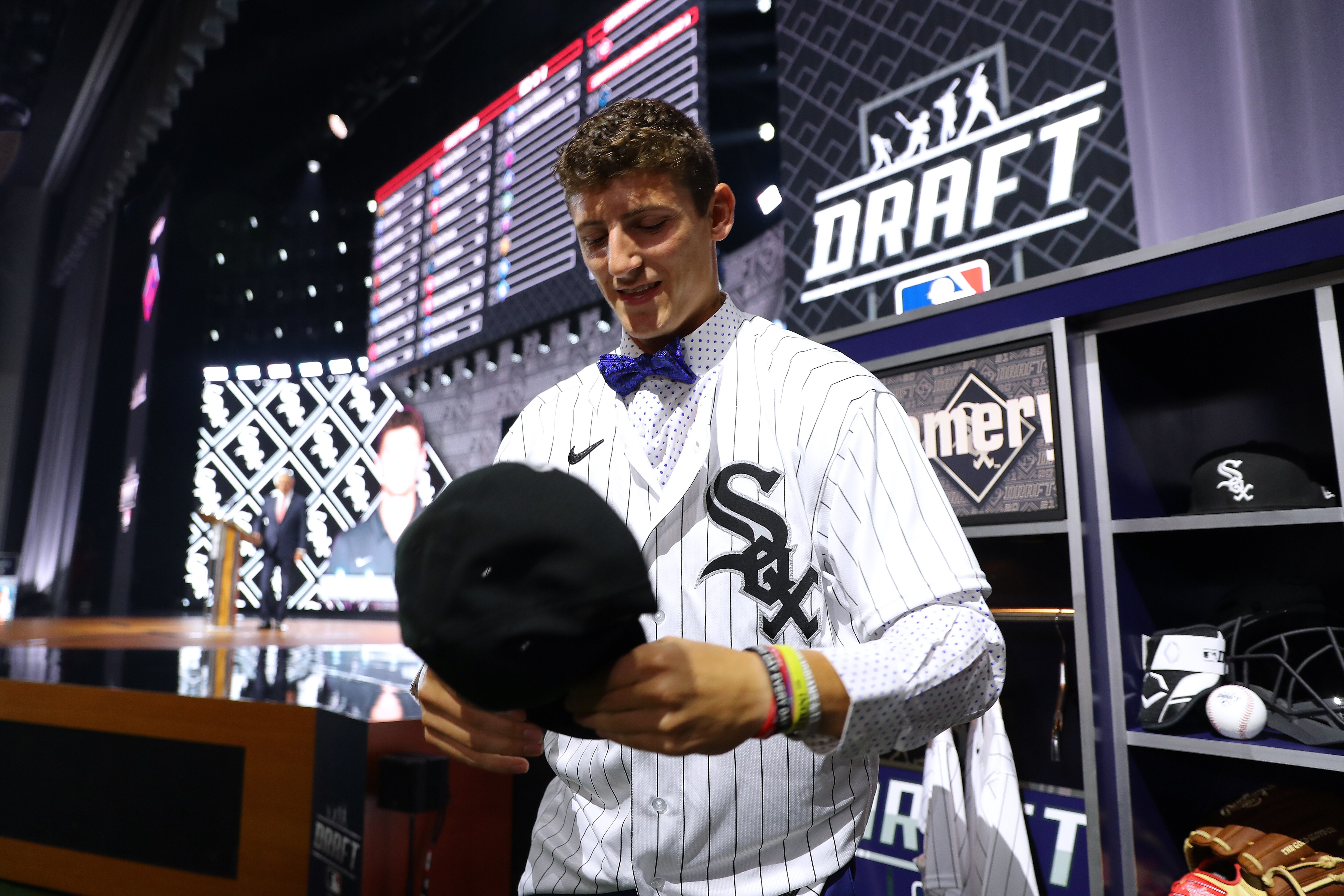 DENVER, CO - JULY 11:  Shortstop Colson Montgomery puts on a cap after being selected 22nd overall by the Chicago White Sox in the first round during the 2021 Major League Baseball Draft at Bellco Theater at Colorado Convention Center on Sunday, July 11, 2021 in Denver, Colorado. (Photo by Mary DeCicco/MLB Photos via Getty Images)