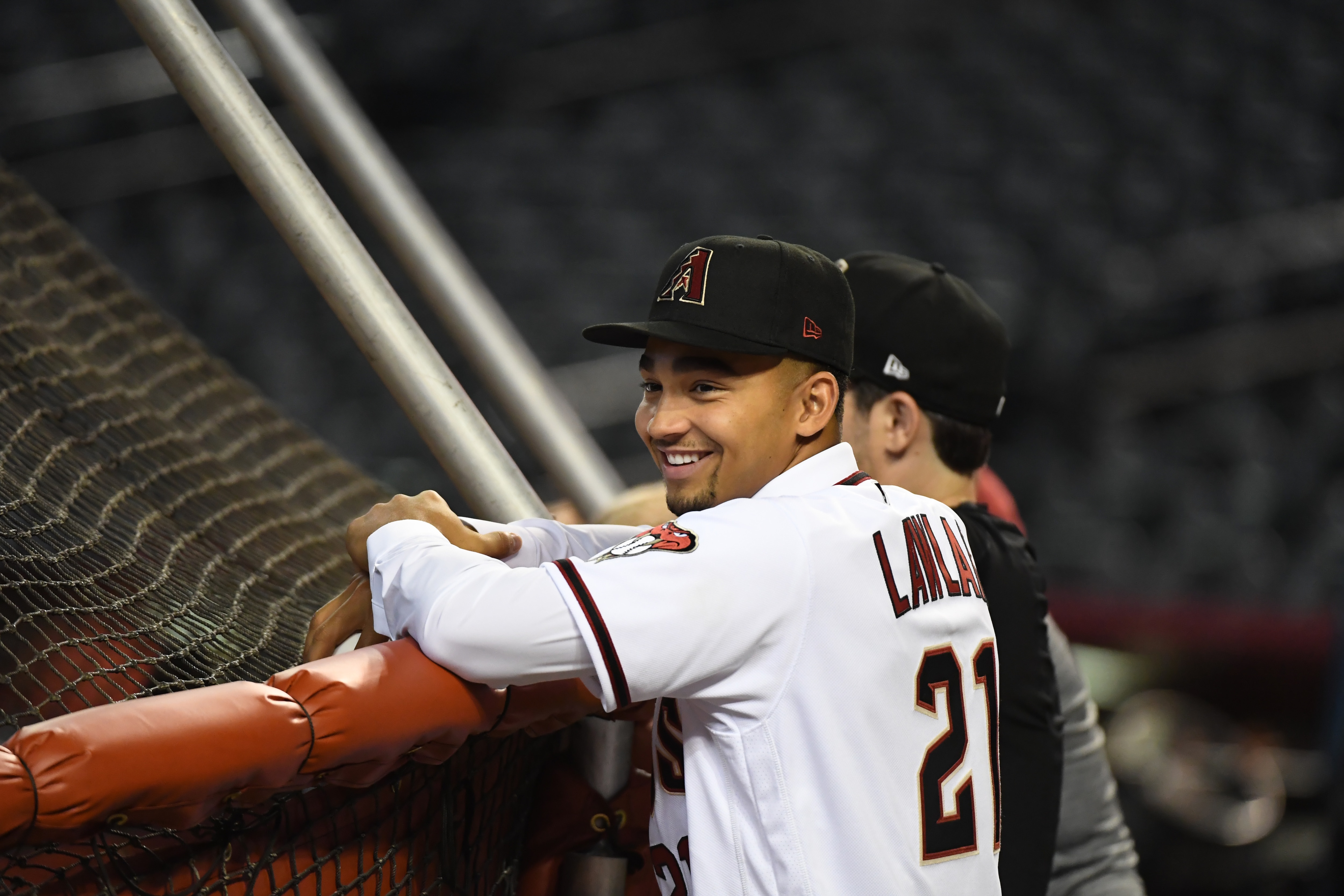 PHOENIX, ARIZONA - JULY 31: 2021 MLB first round draft pick Jordan Lawlar #21 of the Arizona Diamondbacks watches batting practice prior to a game against the Los Angeles Dodgers at Chase Field on July 31, 2021 in Phoenix, Arizona. (Photo by Norm Hall/Getty Images)