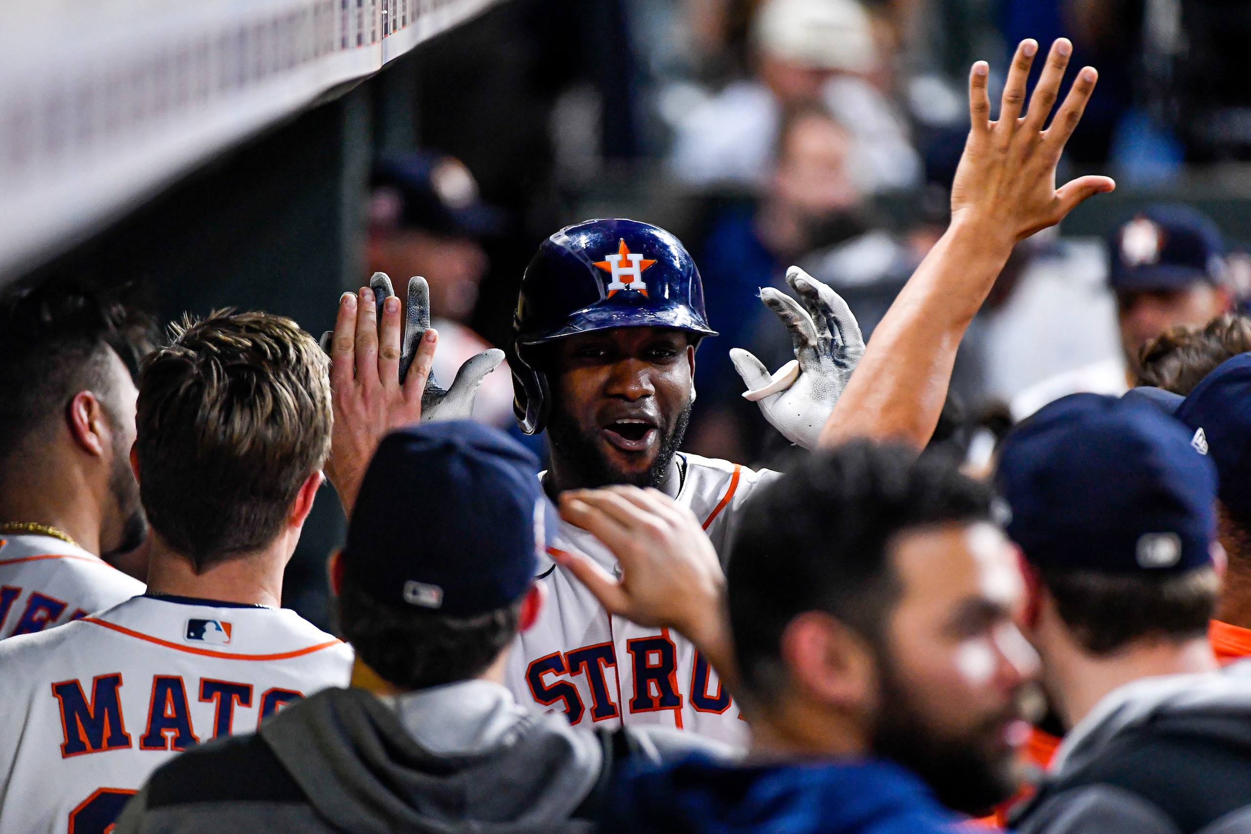 HOUSTON, TEXAS - JULY 05: Yordan Alvarez #44 of the Houston Astros celebrates in the dugout after hitting a solo home run in the 8th inning against the Kansas City Royalsat Minute Maid Park on July 05, 2022 in Houston, Texas. (Photo by Logan Riely/Getty Images)