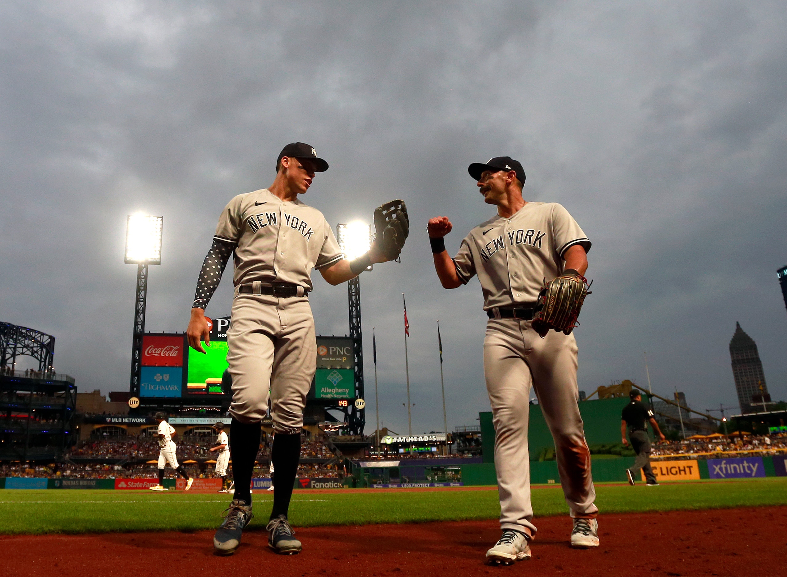 PITTSBURGH, PA - JULY 06:  Aaron Judge #99 and Matt Carpenter #24 of the New York Yankees fist bump while coming off the field against the Pittsburgh Pirates at PNC Park on July 6, 2022 in Pittsburgh, Pennsylvania.  (Photo by Justin K. Aller/Getty Images)