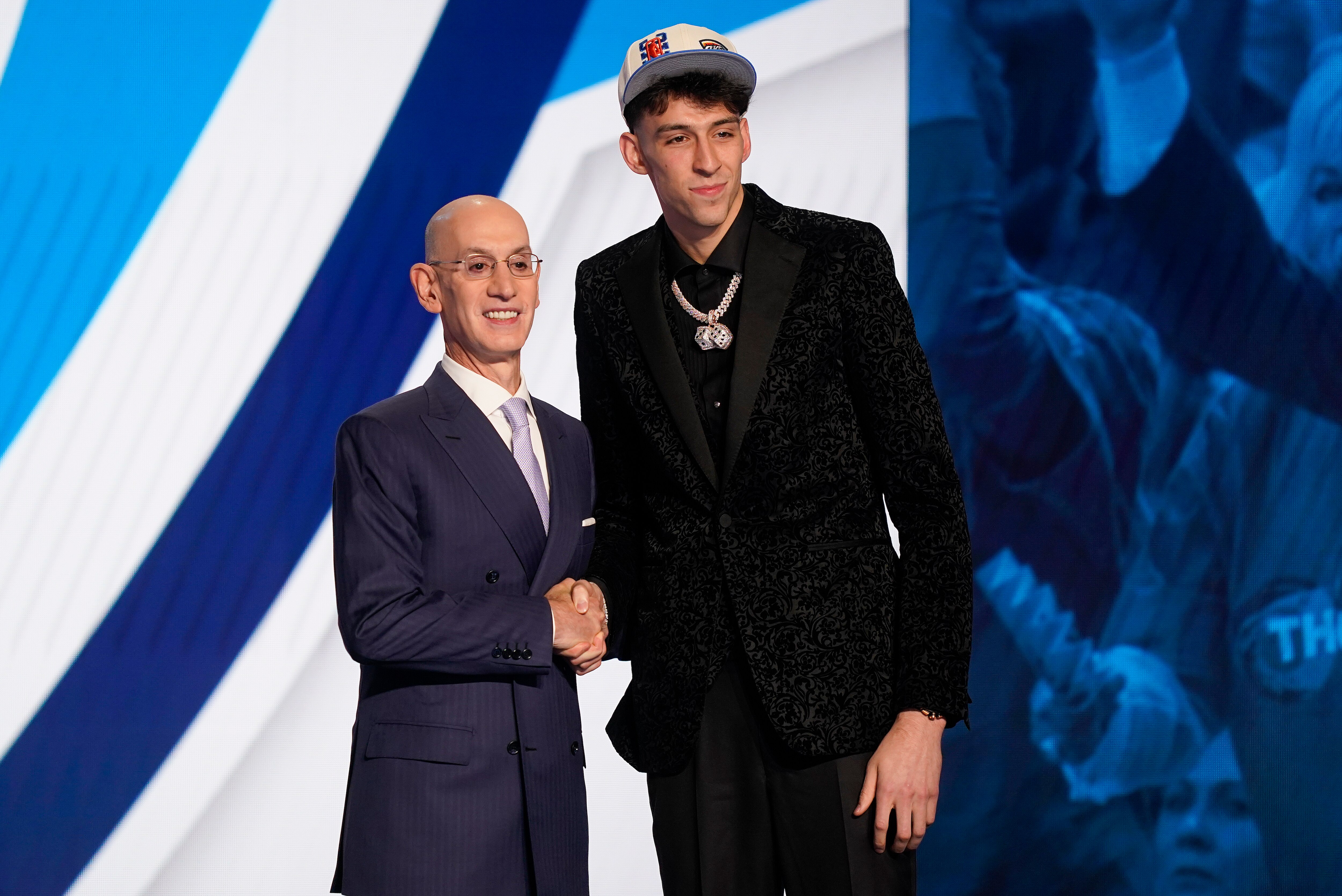 Chet Holmgren, right, poses for photos with NBA Commissioner Adam Silver after being selected second overall in the NBA basketball draft by the Oklahoma Thunder, Thursday, June 23, 2022, in New York. (AP Photo/John Minchillo)