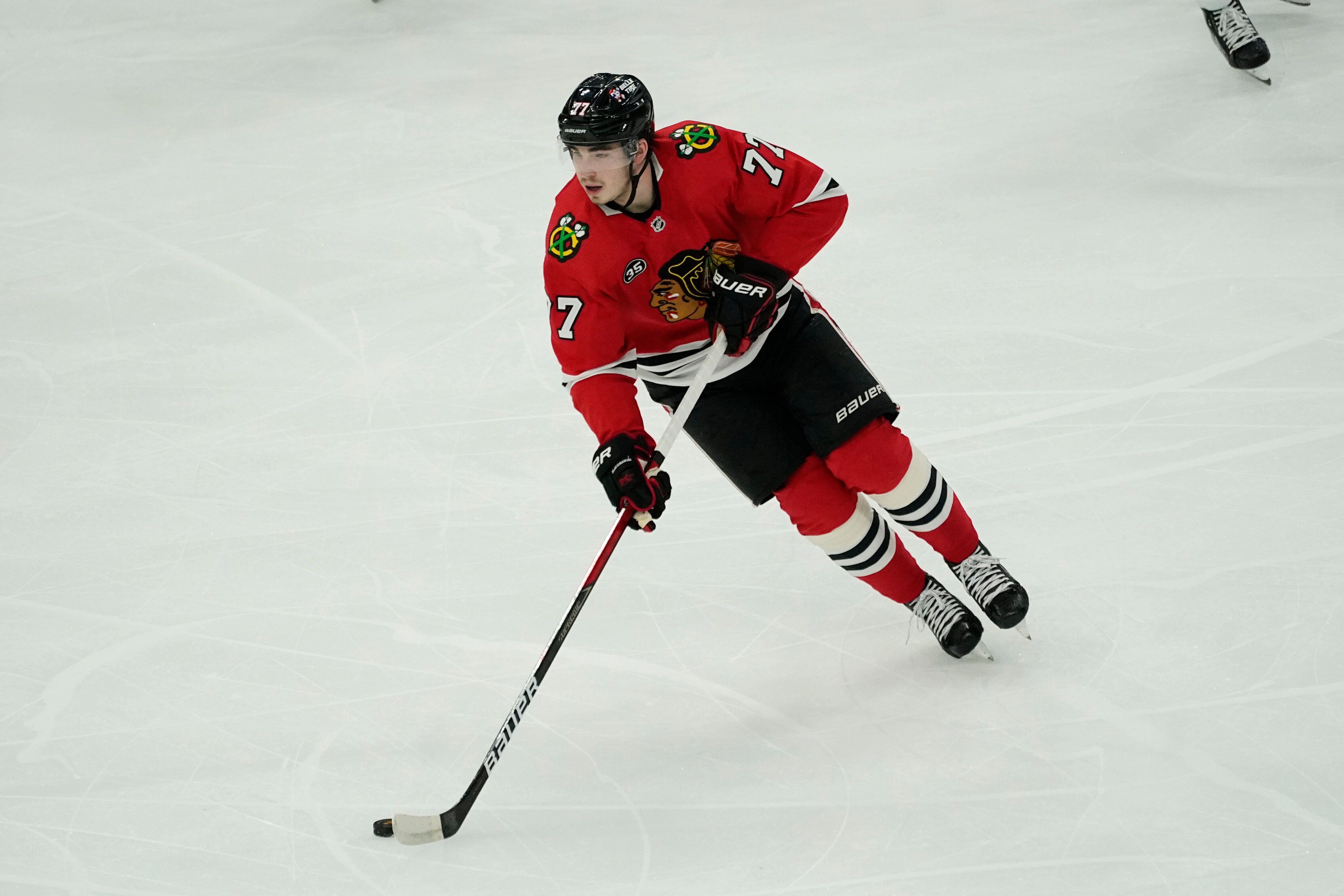 Chicago Blackhawks center Kirby Dach controls the puck against the Winnipeg Jets during the first period of an NHL hockey game in Chicago, Sunday, March 20, 2022. (AP Photo/Nam Y. Huh)