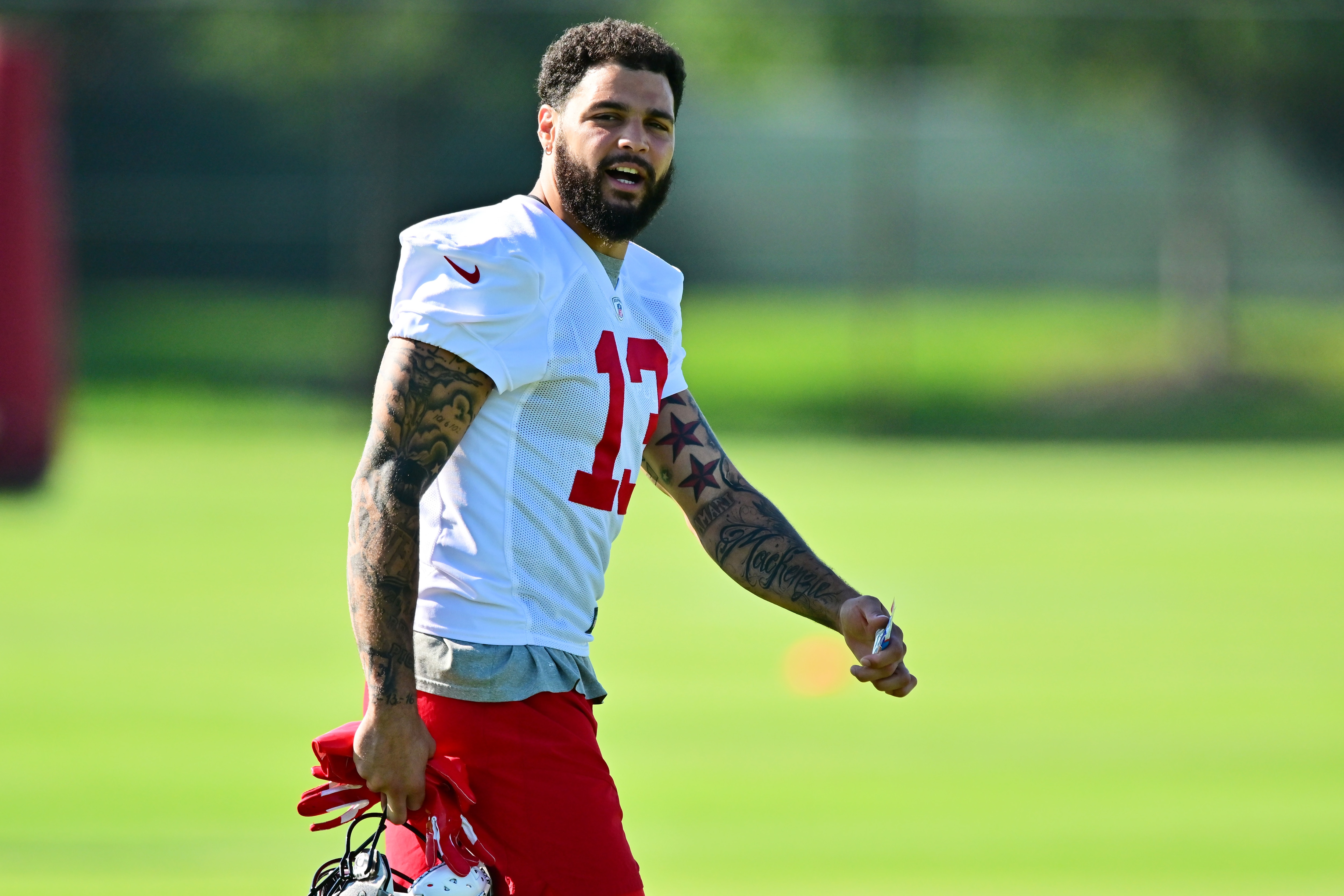 TAMPA, FLORIDA - JUNE 08: Mike Evans #13 of Tampa Bay Buccaneers looks on during the 2022 Buccaneers minicamp at AdventHealth Training Center on June 08, 2022 in Tampa, Florida. (Photo by Julio Aguilar/Getty Images)