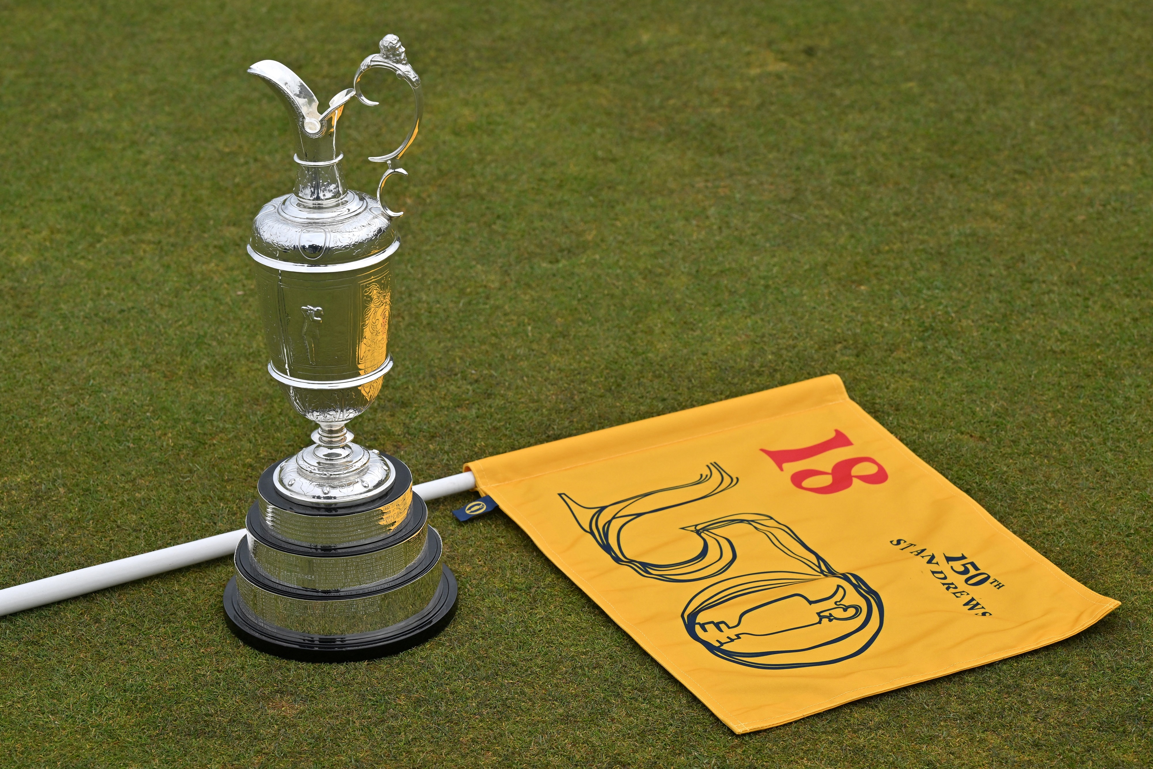 The Claret Jug, the trophy for the Champion Golfer of the Year, is pictured on the 18th Tee, during a preview ahead of the 150th British Open Golf Championship at The Old Course at St. Andrews in Scotland on April 26, 2022. - The Old Course at St Andrews will host The 150th Open from July 10 to 17, 2022. - EDITORIAL USE ONLY (Photo by GLYN KIRK / AFP) / EDITORIAL USE ONLY (Photo by GLYN KIRK/AFP via Getty Images) The Claret Jug, the trophy for the Champion Golfer of the Year, is pictured on the 18th Tee, during a preview ahead of the 150th British Open Golf Championship at The Old Course at St. Andrews in Scotland on April 26, 2022. - The Old Course at St Andrews will host The 150th Open from July 10 to 17, 2022. - EDITORIAL USE ONLY (Photo by GLYN KIRK / AFP) / EDITORIAL USE ONLY (Photo by GLYN KIRK/AFP via Getty Images)