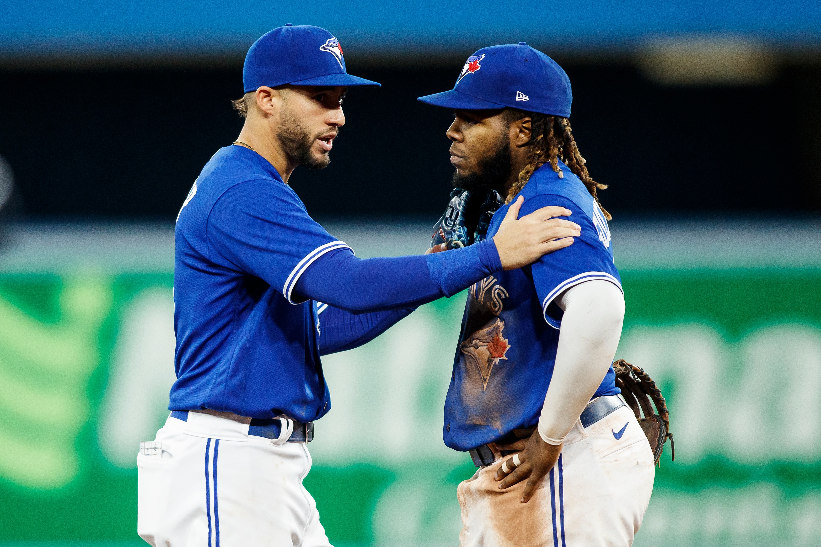 TORONTO, ON - MAY 03: George Springer #4 consoles  Vladimir Guerrero Jr. #27 of the Toronto Blue Jays after he argues a call with umpire Ron Kulpa #46 in the seventh inning of their MLB game against the New York Yankees at Rogers Centre on May 3, 2022 in Toronto, Canada. (Photo by Cole Burston/Getty Images)