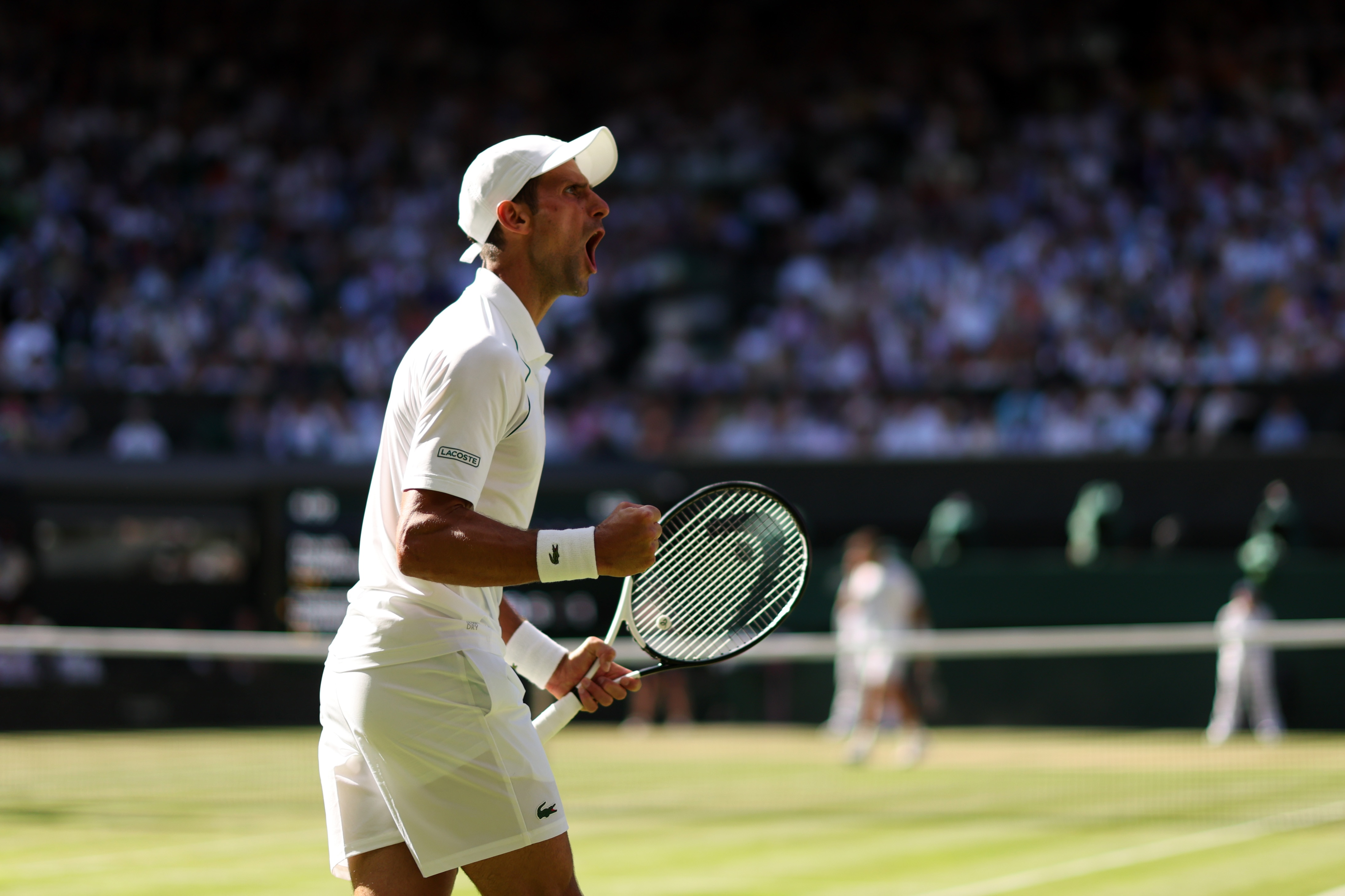 LONDON, ENGLAND - JULY 08: Novak Djokovic of Serbia celebrates against Cameron Norrie of Great Britain during the Mens' Singles Semi Final match on day twelve of The Championships Wimbledon 2022 at All England Lawn Tennis and Croquet Club on July 08, 2022 in London, England. (Photo by Ryan Pierse/Getty Images)