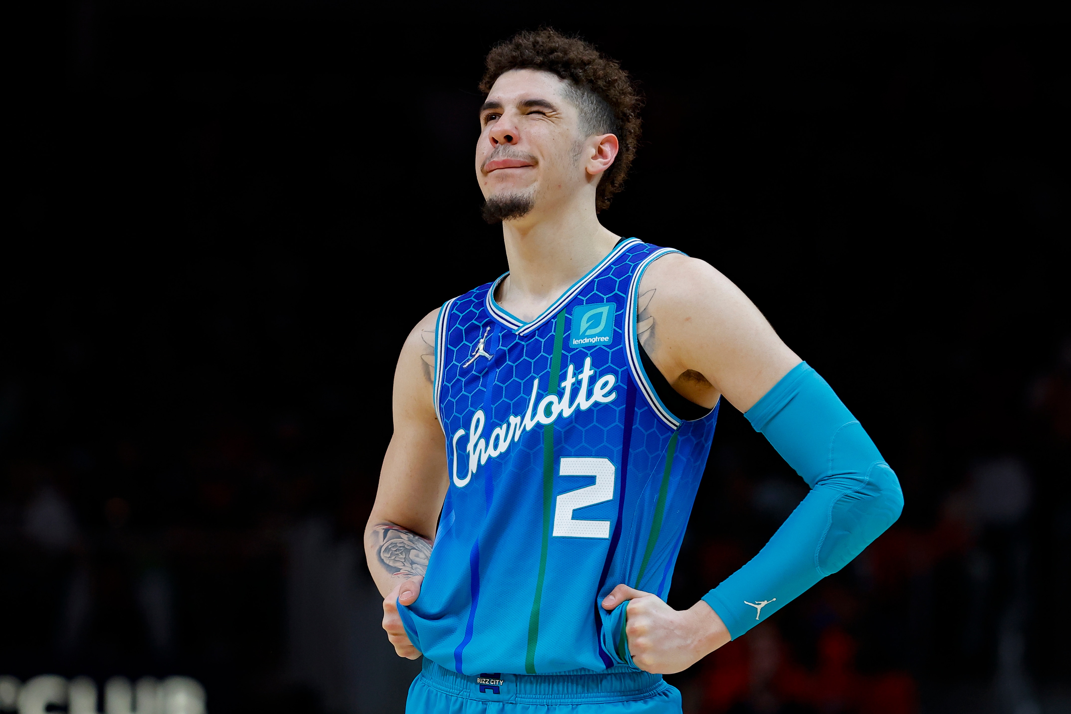 ATLANTA, GA - APRIL 13: LaMelo Ball #2 of the Charlotte Hornets reacts during the second half against the Atlanta Hawks at State Farm Arena on April 13, 2022 in Atlanta, Georgia. NOTE TO USER: User expressly acknowledges and agrees that, by downloading and or using this photograph, User is consenting to the terms and conditions of the Getty Images License Agreement. (Photo by Todd Kirkland/Getty Images)