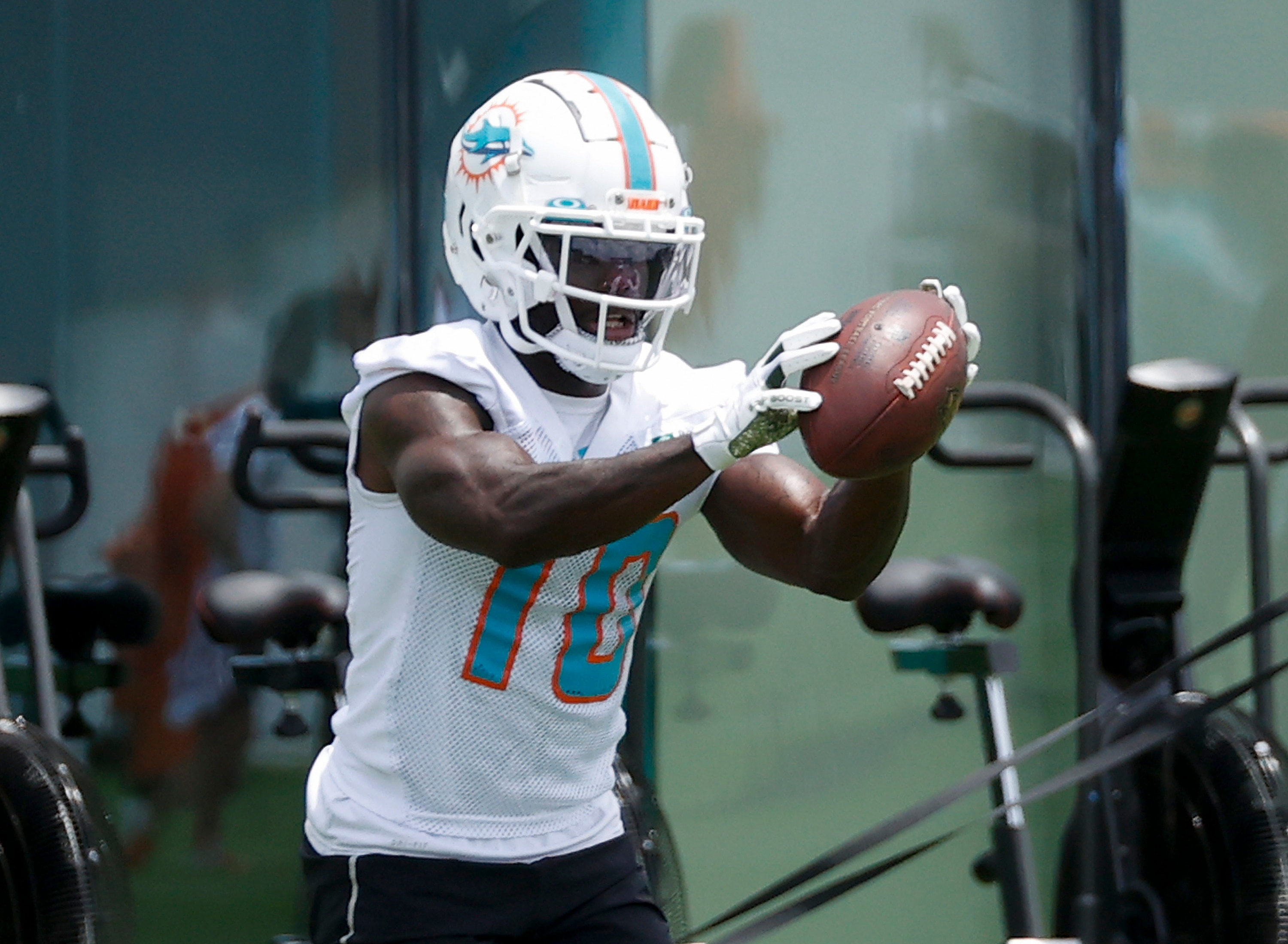 MIAMI GARDENS, FL - MAY 24: Tyreek Hill #10 of the Miami Dolphins catches the ball during the Miami Dolphins OTAs at the Baptist Health Training Complex on May 24, 2022 in Miami Gardens, Florida. (Photo by Joel Auerbach/Getty Images)