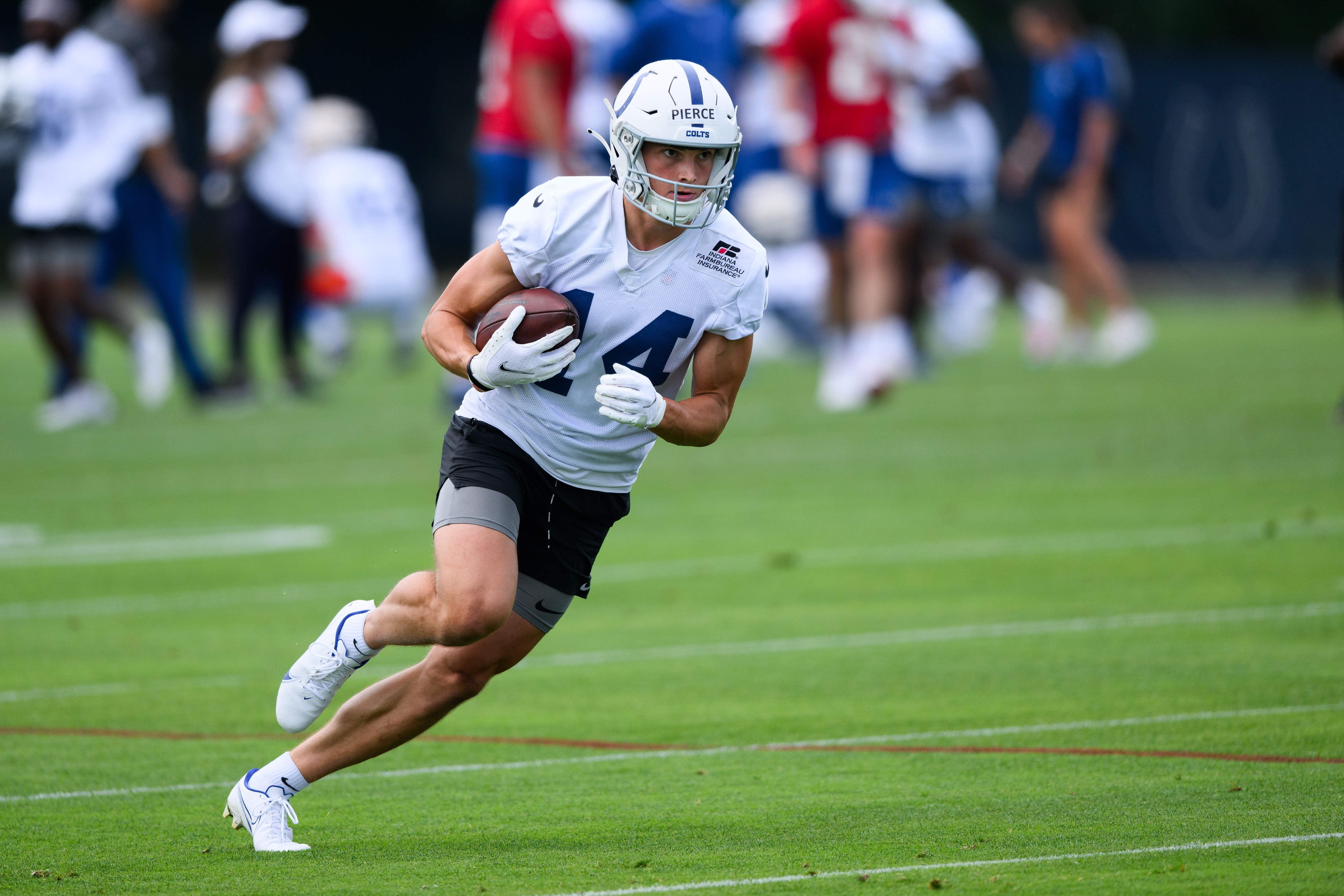 INDIANAPOLIS, IN - JUNE 07: Indianapolis Colts wide receiver Alec Pierce (14) runs through a drill during the Indianapolis Colts OTA offseason workouts on June 7, 2022 at the Indiana Farm Bureau Football Center in Indianapolis, IN. (Photo by Zach Bolinger/Icon Sportswire via Getty Images)