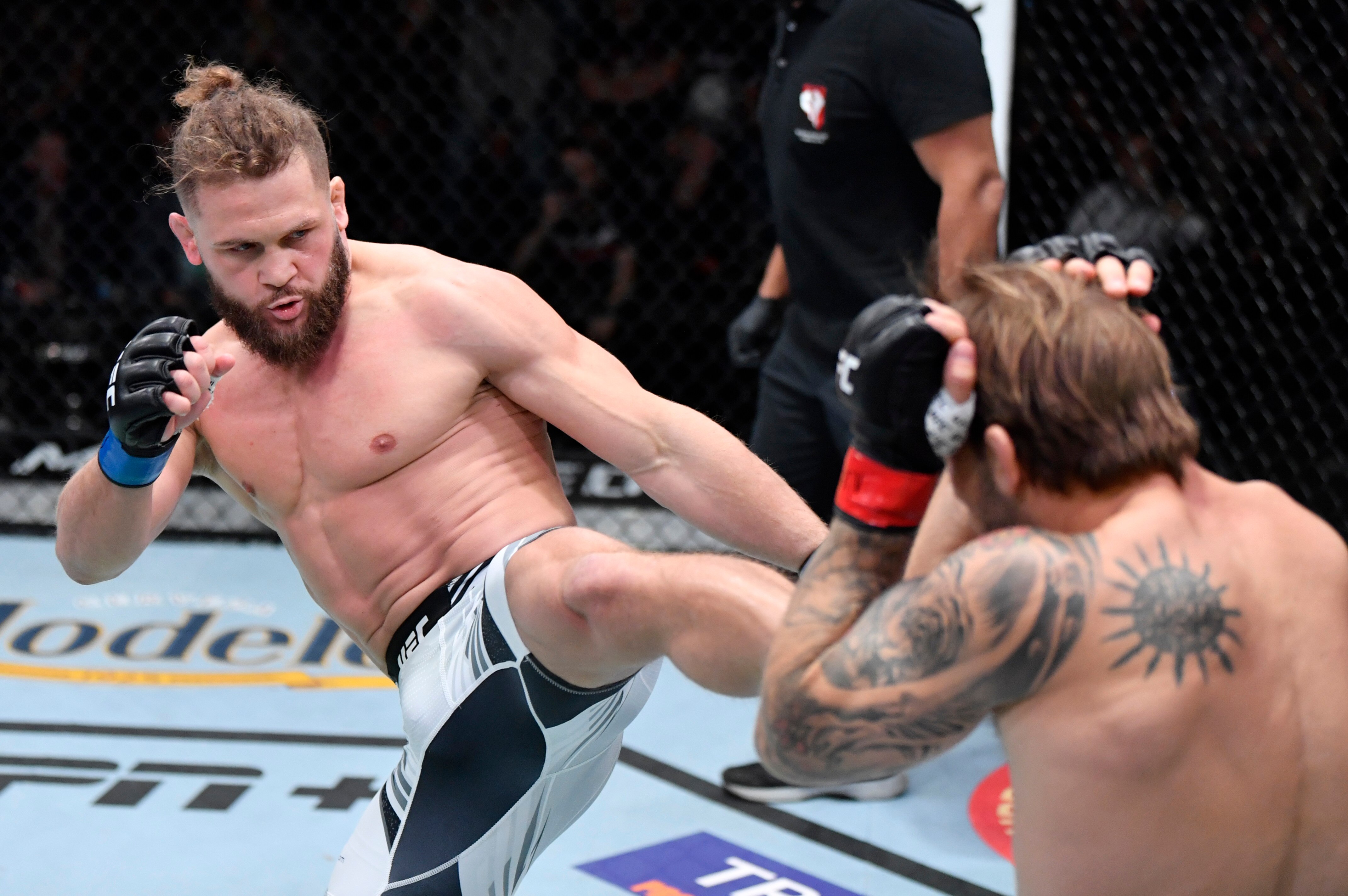 LAS VEGAS, NEVADA - DECEMBER 04: (L-R) Rafael Fiziev of Kyrgyzstan kicks Brad Riddell of New Zealand in their lightweight fight during the UFC Fight Night event at UFC APEX on December 04, 2021 in Las Vegas, Nevada. (Photo by Jeff Bottari/Zuffa LLC)