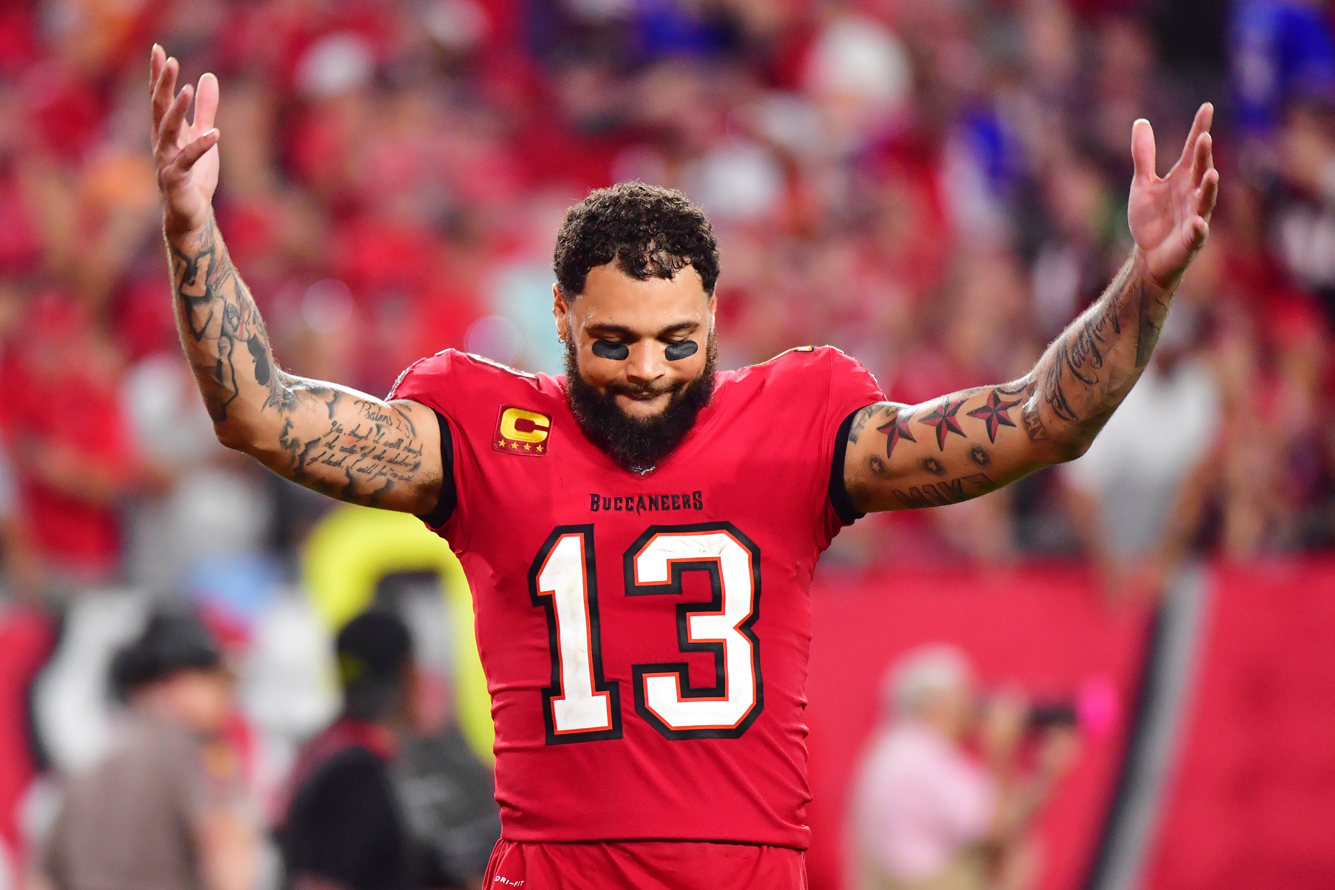 TAMPA, FLORIDA - DECEMBER 12: Mike Evans #13 celebrates after the Tampa Bay Buccaneers defeated the Buffalo Bills 33-27 in overtime at Raymond James Stadium on December 12, 2021 in Tampa, Florida. (Photo by Julio Aguilar/Getty Images)