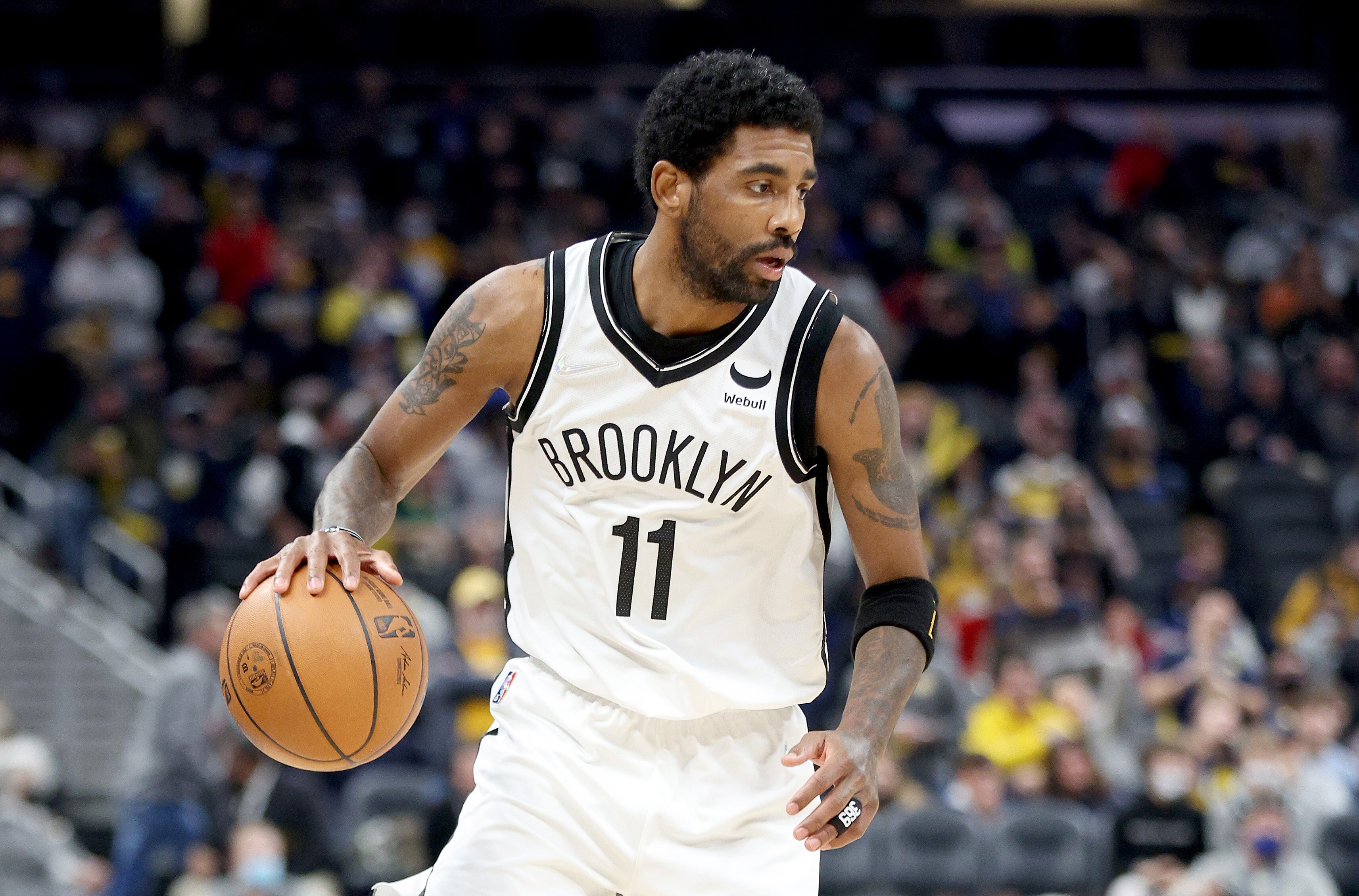 INDIANAPOLIS, INDIANA - JANUARY 05: Kyrie Irving #11of the Brooklyn Nets dribbles the ball during the game against the Indiana Pacers at Gainbridge Fieldhouse on January 05, 2022 in Indianapolis, Indiana.    NOTE TO USER: User expressly acknowledges and agrees that, by downloading and or using this Photograph, user is consenting to the terms and conditions of the Getty Images License Agreement.  (Photo by Andy Lyons/Getty Images)