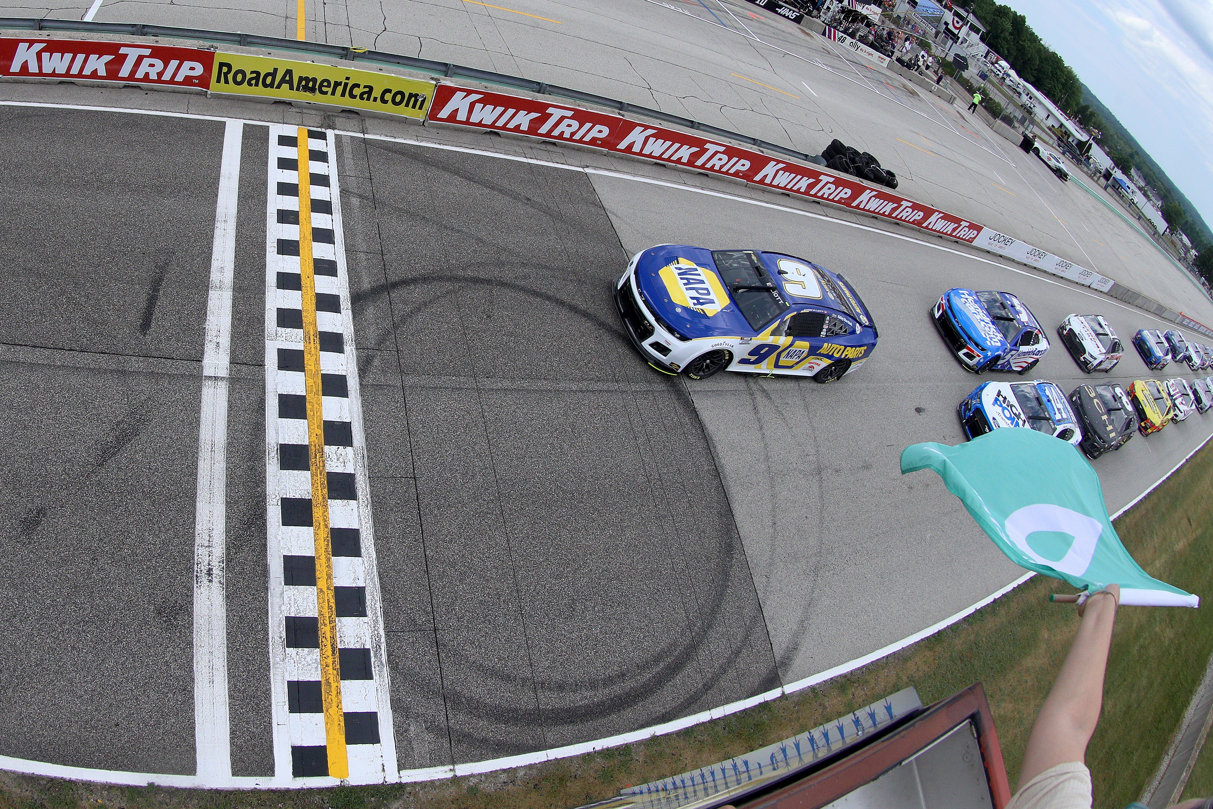 ELKHART LAKE, WISCONSIN - JULY 03: Chase Elliott, driver of the #9 NAPA Auto Parts Chevrolet, leads the field to the green flag to start the NASCAR Cup Series Kwik Trip 250 at Road America on July 03, 2022 in Elkhart Lake, Wisconsin. (Photo by Logan Riely/Getty Images)