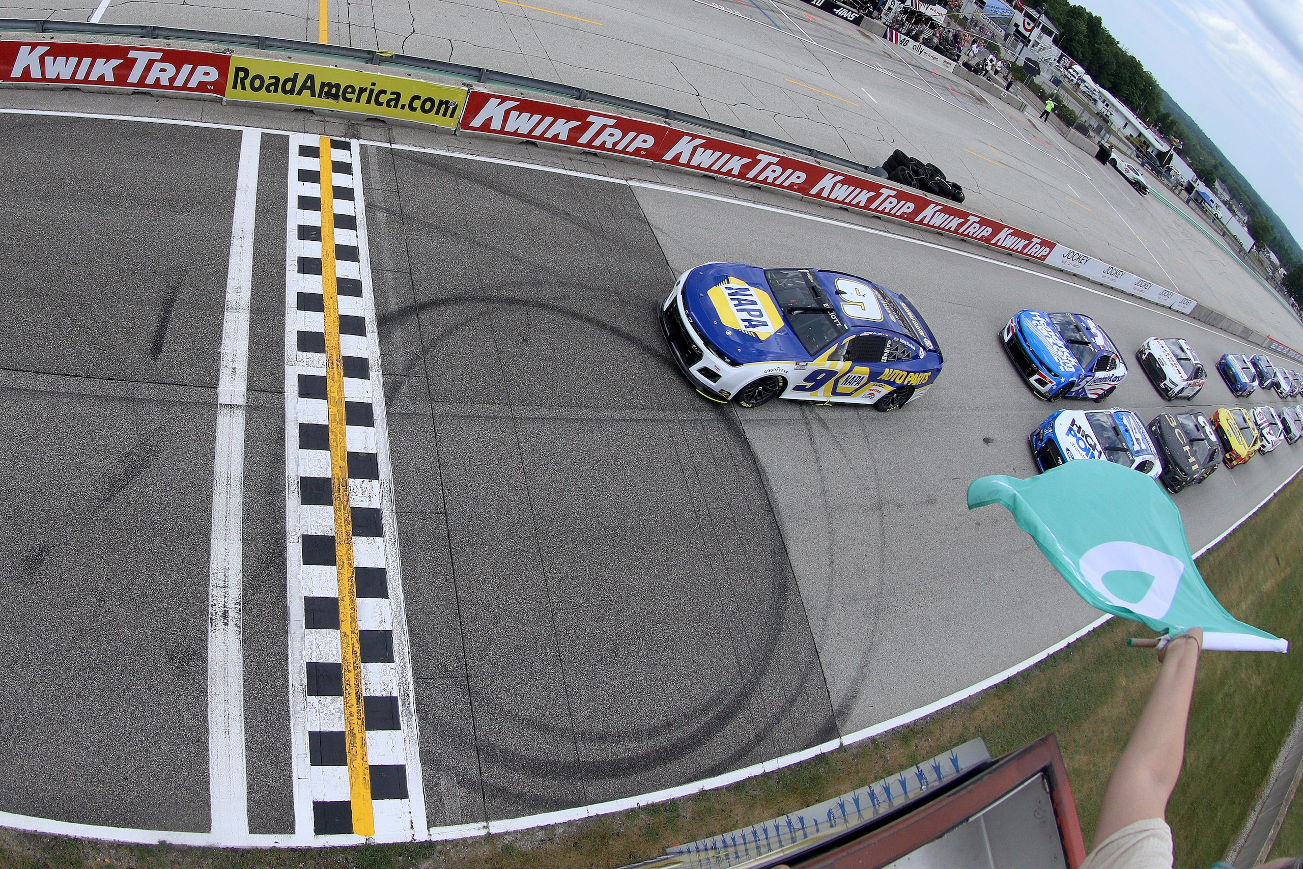 ELKHART LAKE, WISCONSIN - JULY 03: Chase Elliott, driver of the #9 NAPA Auto Parts Chevrolet, leads the field to the green flag to start the NASCAR Cup Series Kwik Trip 250 at Road America on July 03, 2022 in Elkhart Lake, Wisconsin. (Photo by Logan Riely/Getty Images)