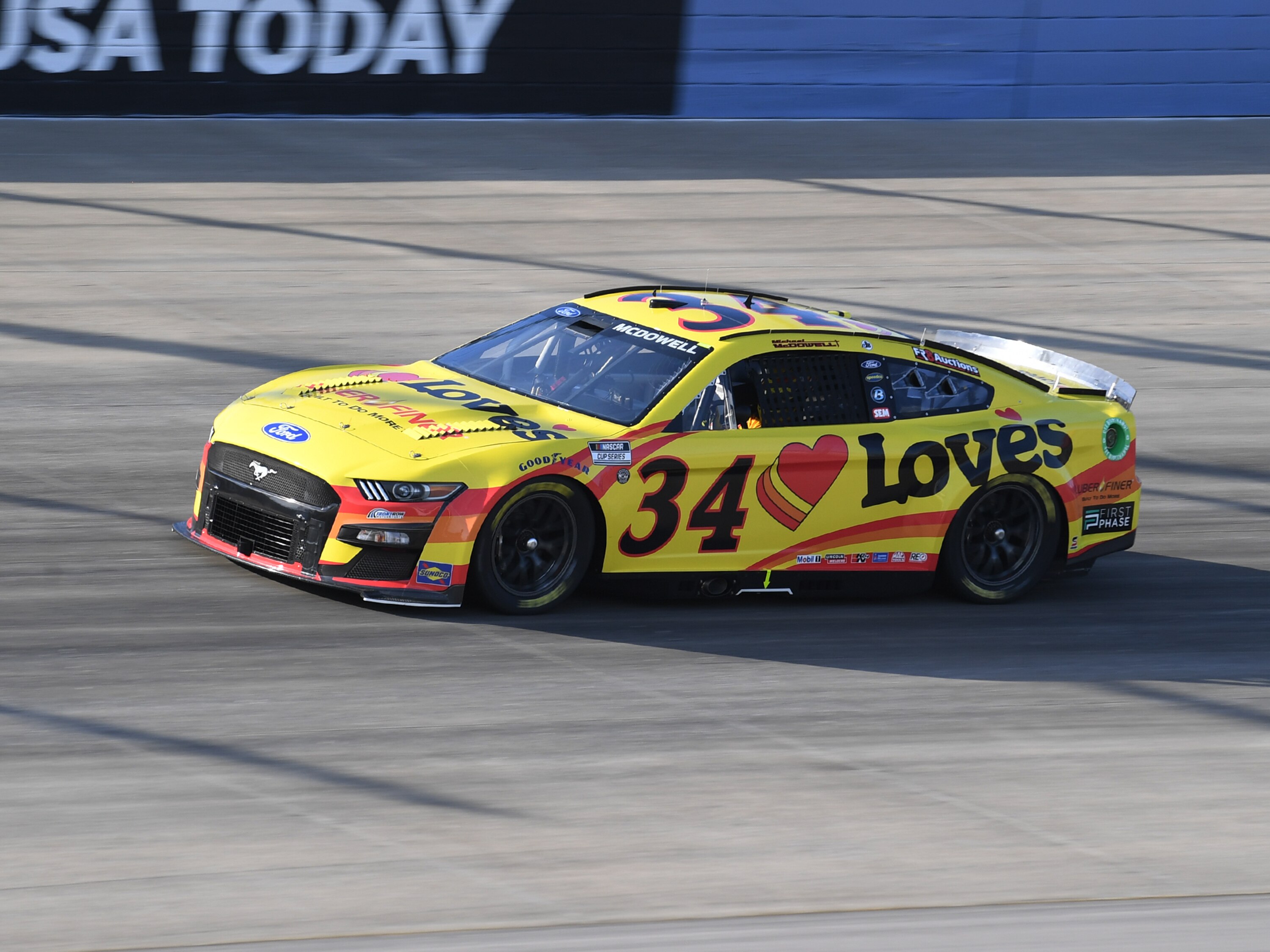 NASHVILLE, TN - JUNE 24: Michael McDowell (#34 Front Row Motorsports Love's Travel Stops Ford) races through turn 4 during practice for the running of the NASCAR Cup Series Ally 400 on June 24, 2022, at Nashville Superspeedway in Lebanon, TN. (Photo by Jeffrey Vest/Icon Sportswire via Getty Images)