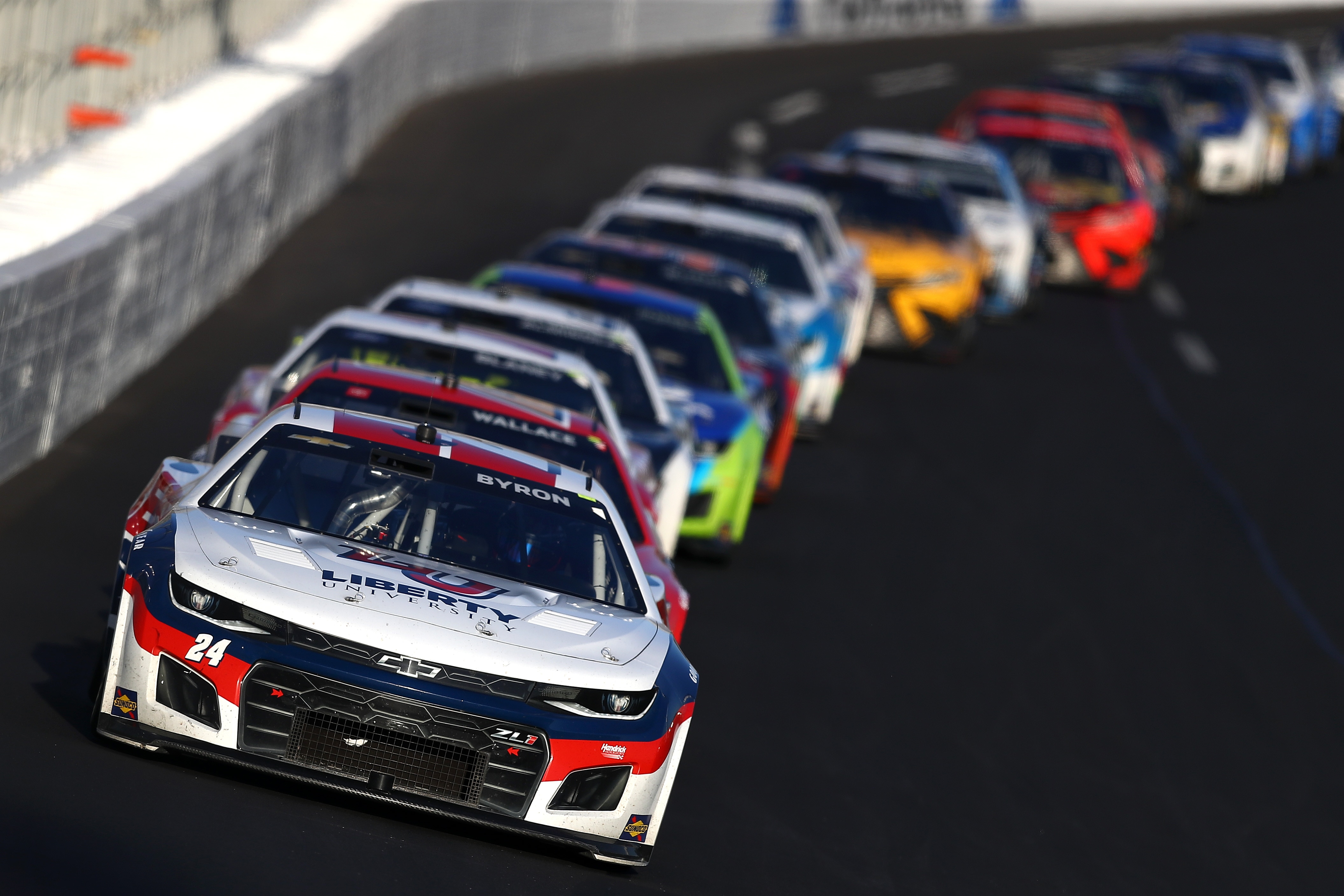 HAMPTON, GEORGIA - MARCH 20: William Byron, driver of the #24 Liberty University Chevrolet, leads the field during the NASCAR Cup Series Folds of Honor QuikTrip 500 at Atlanta Motor Speedway on March 20, 2022 in Hampton, Georgia. (Photo by Mike Mulholland/Getty Images)