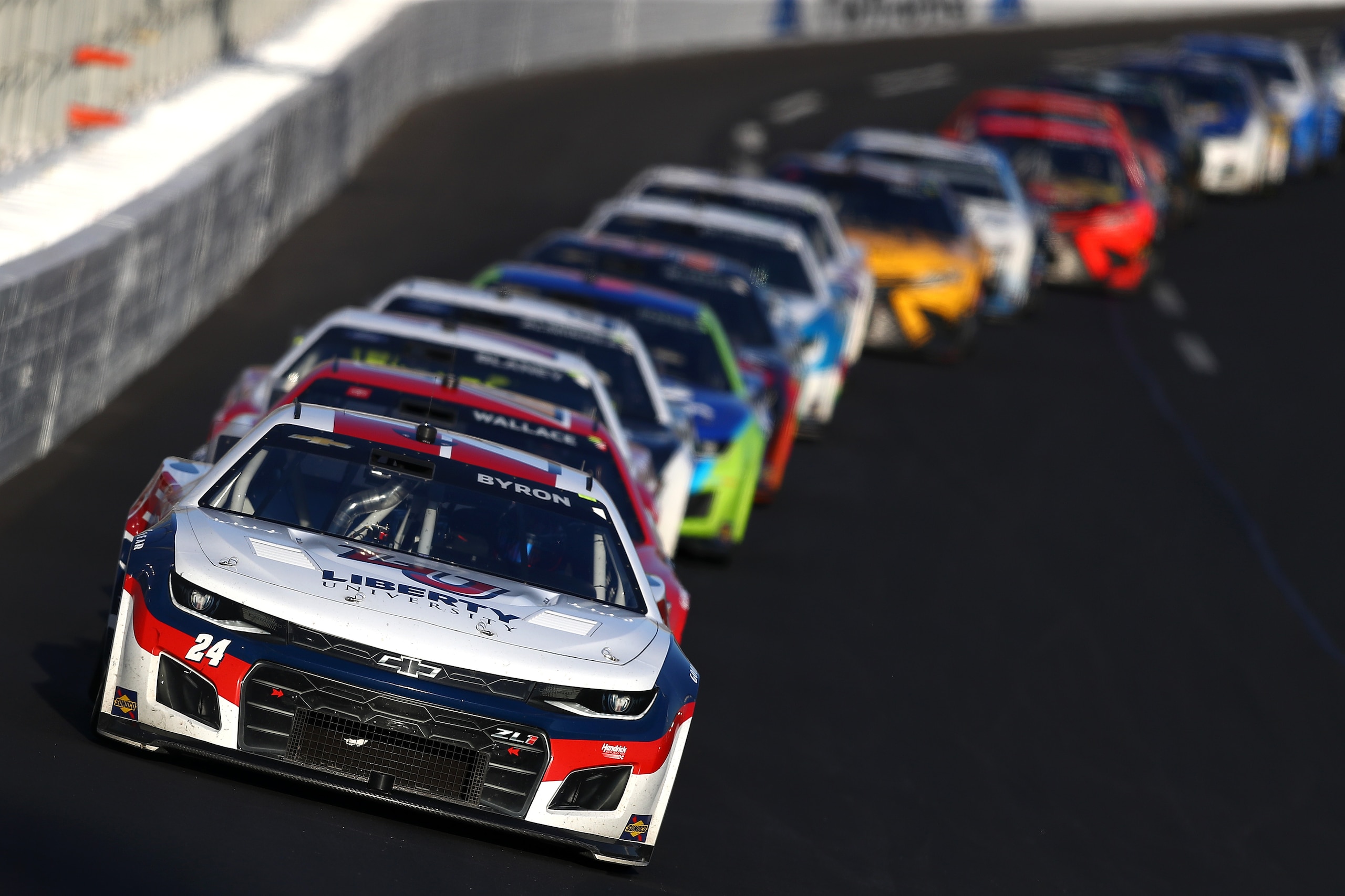 HAMPTON, GEORGIA - MARCH 20: William Byron, driver of the #24 Liberty University Chevrolet, leads the field during the NASCAR Cup Series Folds of Honor QuikTrip 500 at Atlanta Motor Speedway on March 20, 2022 in Hampton, Georgia. (Photo by Mike Mulholland/Getty Images)