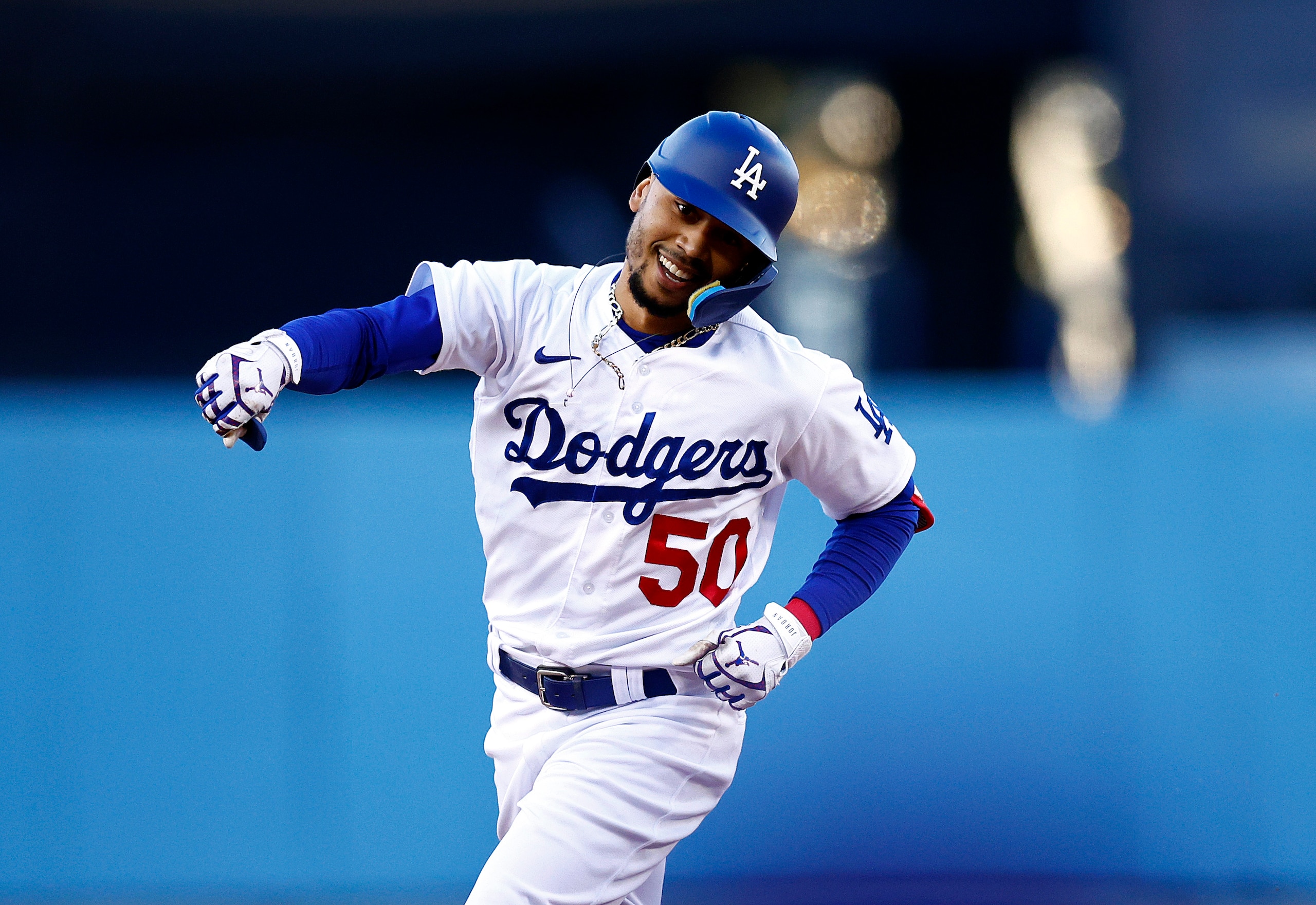 LOS ANGELES, CALIFORNIA - JULY 07:  Mookie Betts #50 of the Los Angeles Dodgers celebrates a home run against the Chicago Cubs in the first inning at Dodger Stadium on July 07, 2022 in Los Angeles, California. (Photo by Ronald Martinez/Getty Images)
