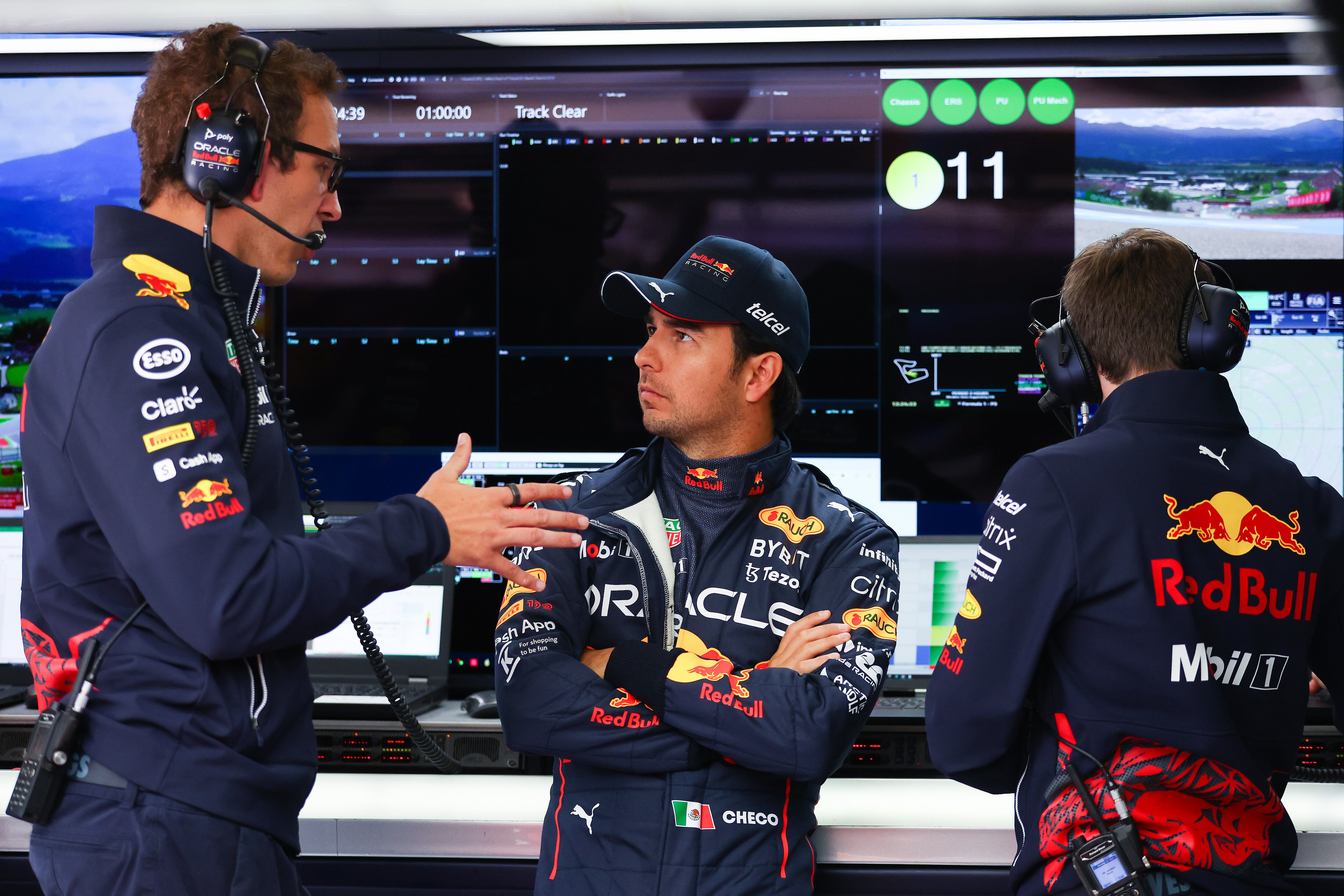 SPIELBERG, AUSTRIA - JULY 09: Sergio Perez of Mexico and Oracle Red Bull Racing talks with race engineer Hugh Bird in the garage during practice ahead of the F1 Grand Prix of Austria at Red Bull Ring on July 09, 2022 in Spielberg, Austria. (Photo by Bryn Lennon/Getty Images) SPIELBERG, AUSTRIA - JULY 09: Sergio Perez of Mexico and Oracle Red Bull Racing talks with race engineer Hugh Bird in the garage during practice ahead of the F1 Grand Prix of Austria at Red Bull Ring on July 09, 2022 in Spielberg, Austria. (Photo by Bryn Lennon/Getty Images)