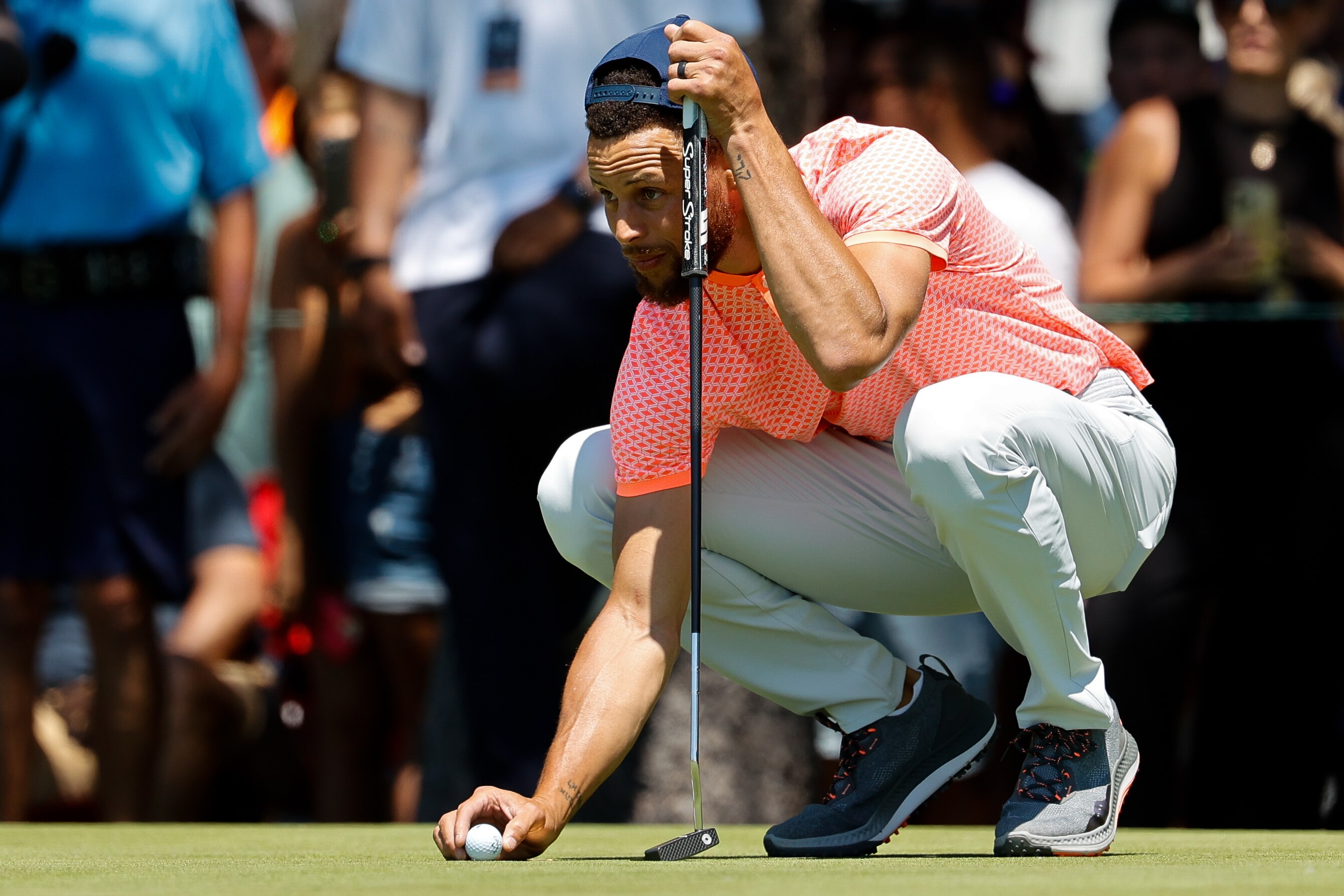STATELINE, NV - JULY 08:  NBA basketball player Stephen Curry places the ball on the 17th putting green during Round One of the 2022 American Century Championship at Edgewood Tahoe Golf Course on July 8, 2022 in Stateline, Nevada. (Photo by Isaiah Vazquez/Clarkson Creative/Getty Images)