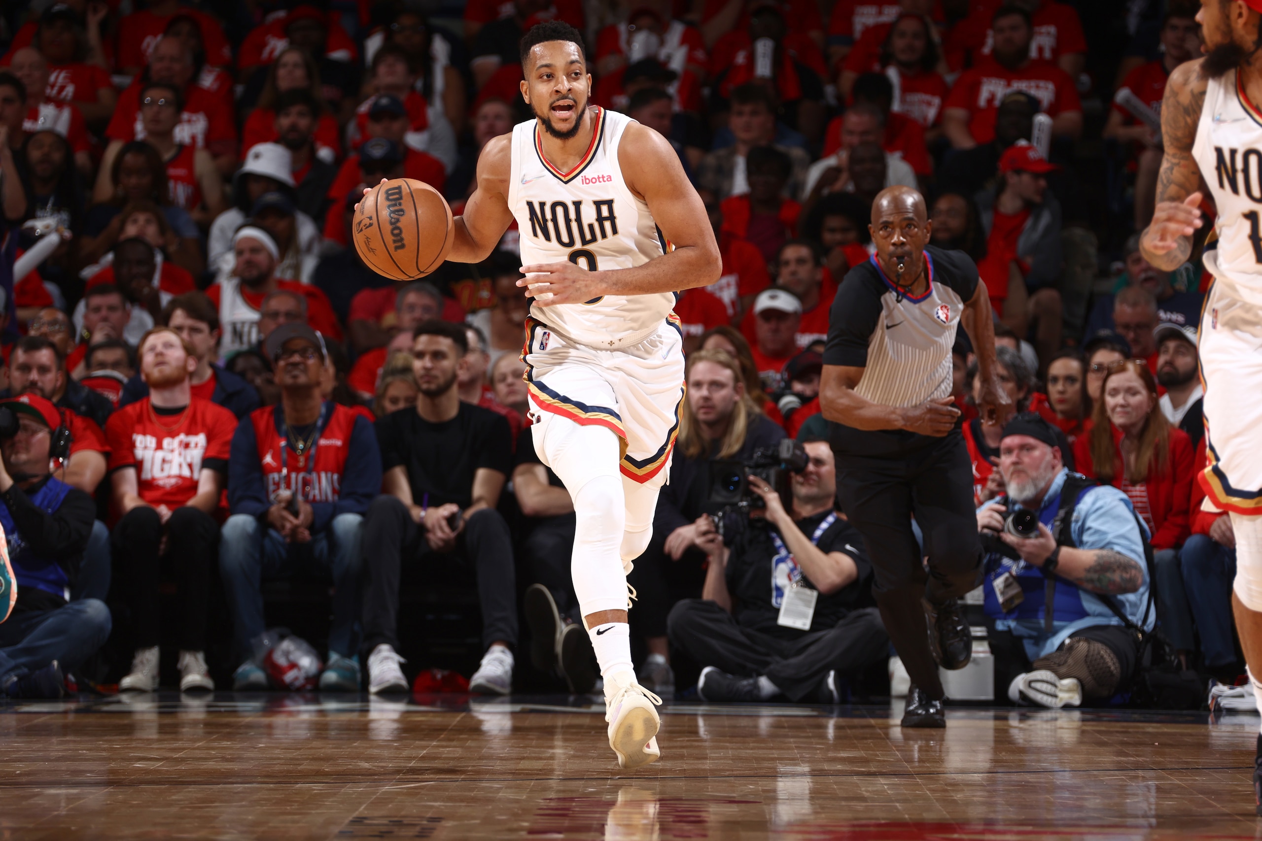 NEW ORLEANS, LA - APRIL 24: CJ McCollum #3 of the New Orleans Pelicans dribbles the ball during the game against the Phoenix Suns during Round 1 Game 4 of the 2022 NBA Playoffs on April 24, 2022 at the Smoothie King Center in New Orleans, Louisiana. NOTE TO USER: User expressly acknowledges and agrees that, by downloading and or using this Photograph, user is consenting to the terms and conditions of the Getty Images License Agreement. Mandatory Copyright Notice: Copyright 2022 NBAE (Photo by Ned Dishman/NBAE via Getty Images)