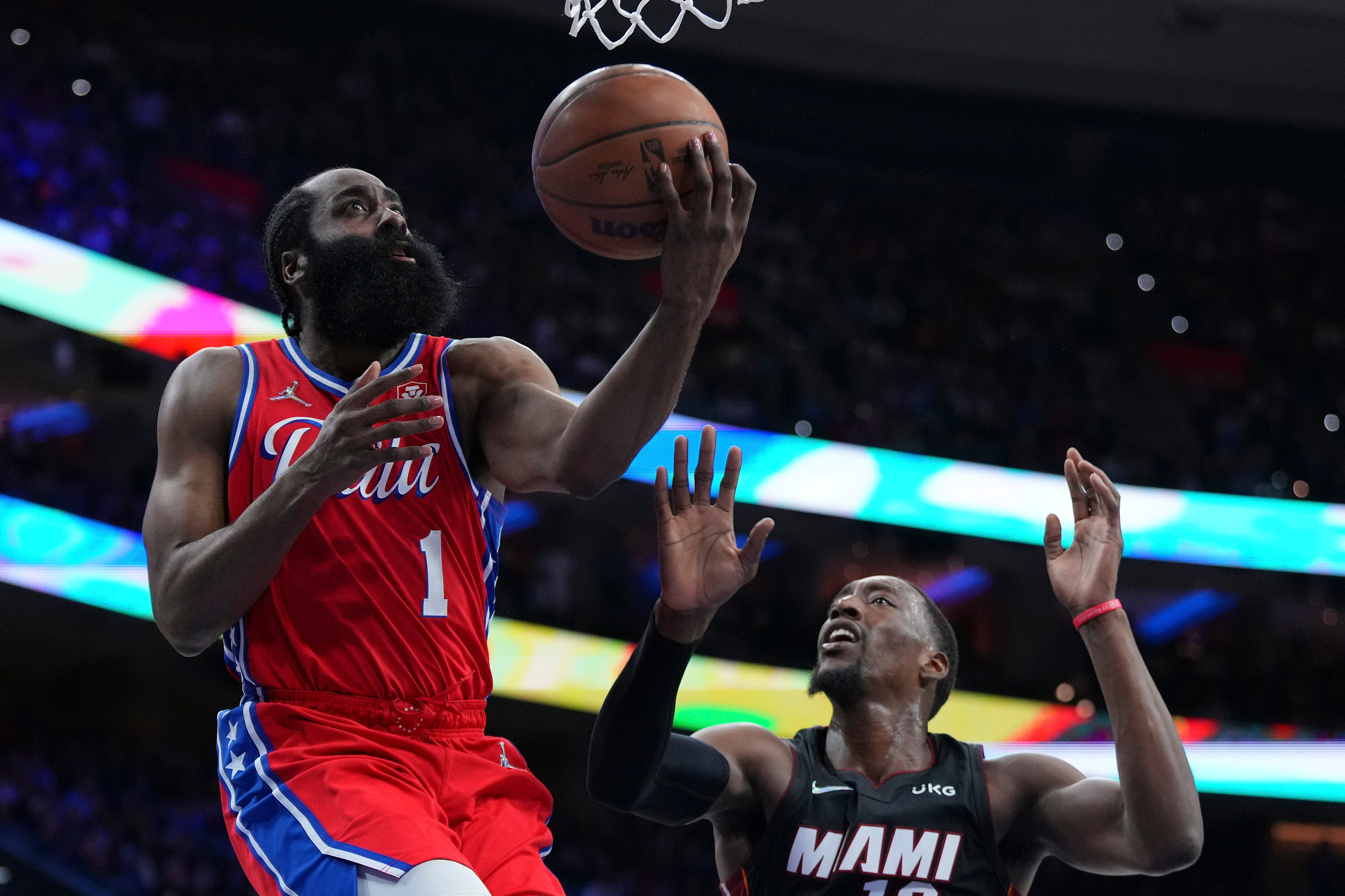 PHILADELPHIA, PA - MAY 08: James Harden #1 of the Philadelphia 76ers shoots the ball against Bam Adebayo #13 of the Miami Heat during Game Four of the 2022 NBA Playoffs Eastern Conference Semifinals at the Wells Fargo Center on May 8, 2022 in Philadelphia, Pennsylvania. The 76ers defeated the Heat 116-108. NOTE TO USER: User expressly acknowledges and agrees that, by downloading and or using this photograph, User is consenting to the terms and conditions of the Getty Images License Agreement. (Photo by Mitchell Leff/Getty Images)