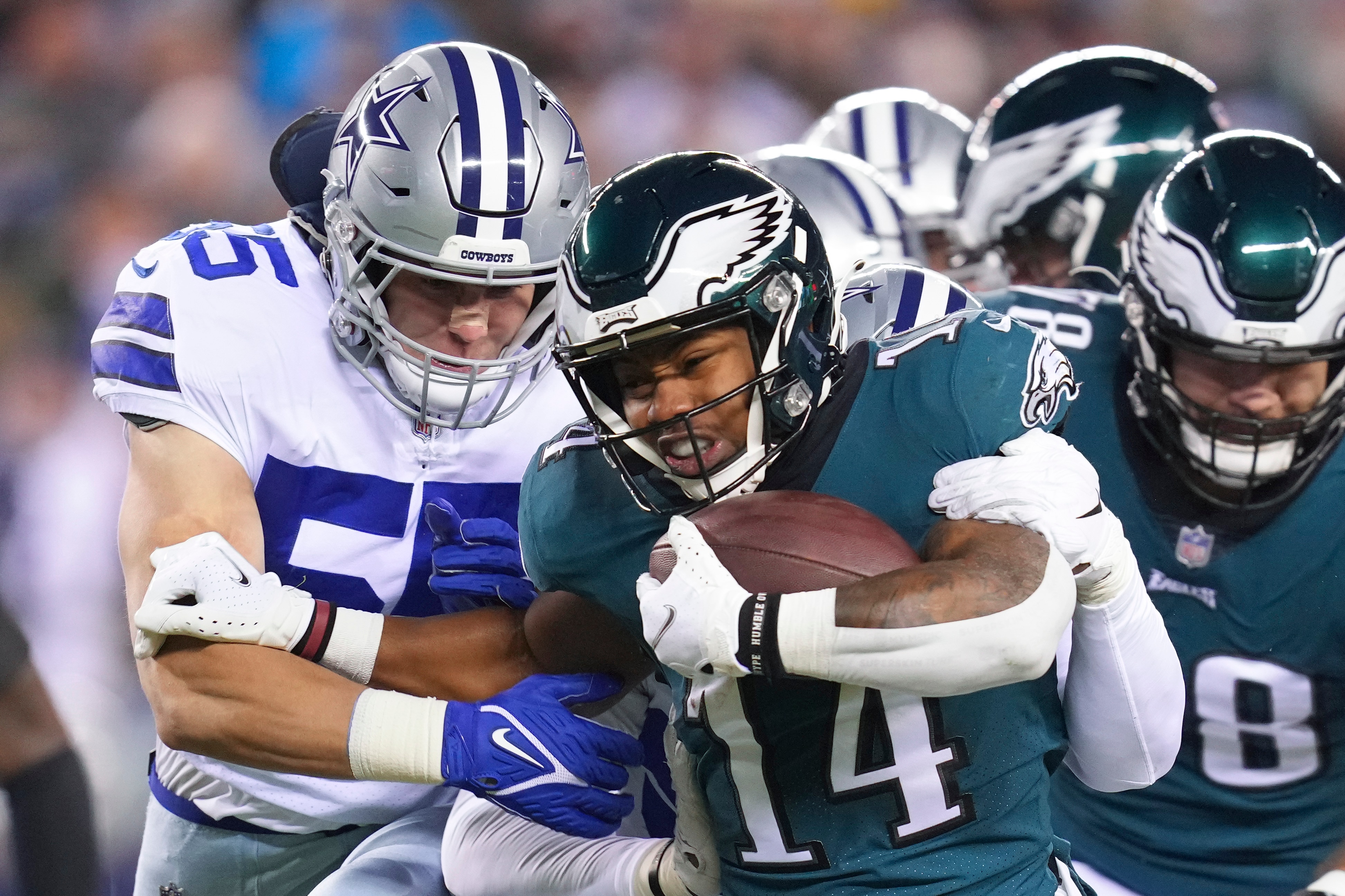 PHILADELPHIA, PA - JANUARY 08: Kenneth Gainwell #14 of the Philadelphia Eagles runs the ball against Leighton Vander Esch #55 of the Dallas Cowboys at Lincoln Financial Field on January 8, 2022 in Philadelphia, Pennsylvania. (Photo by Mitchell Leff/Getty Images)