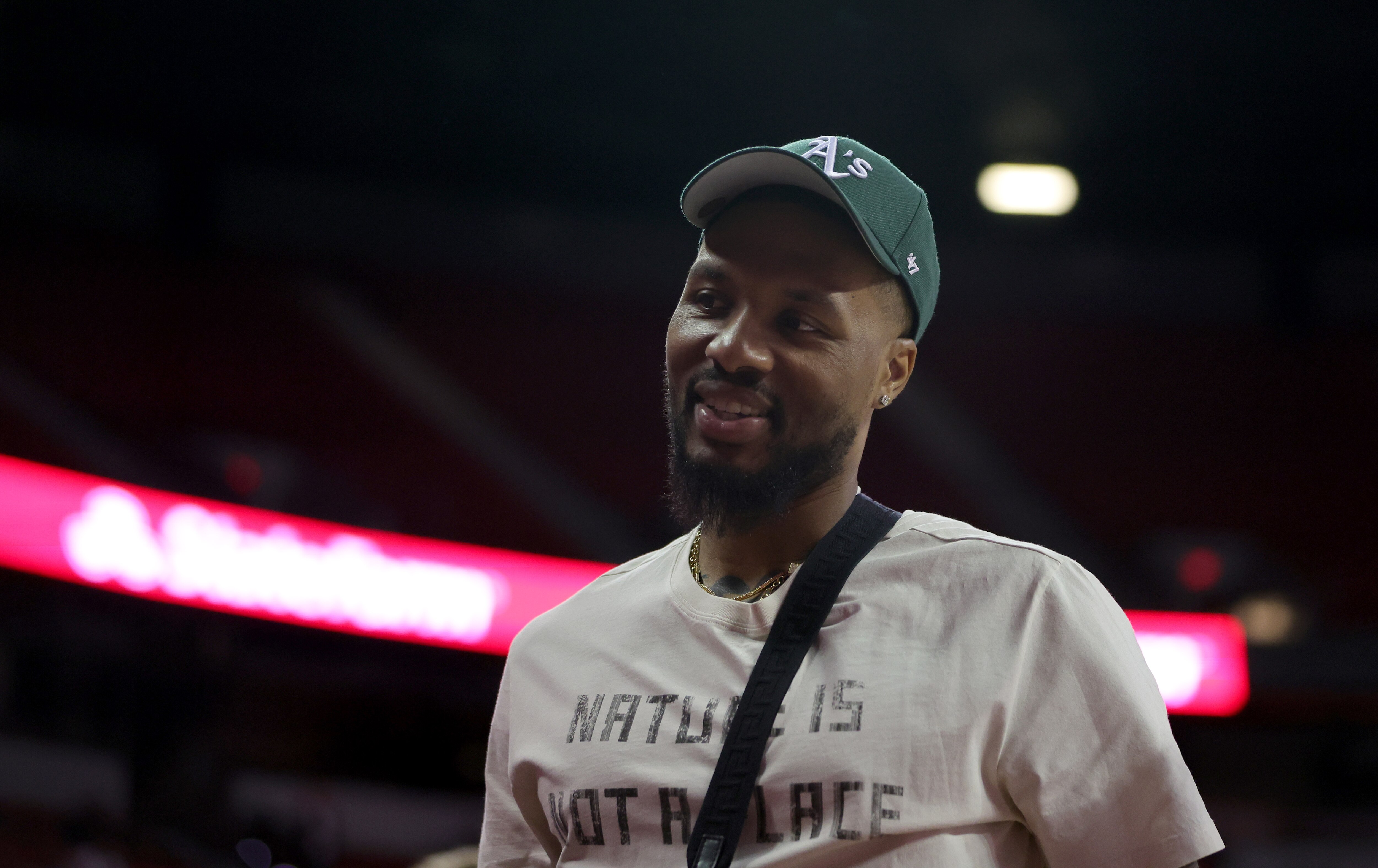LAS VEGAS, NEVADA - JULY 07: Damian Lillard of the Portland Trail Blazers attends a game between the Trail Blazers and the Detroit Pistons during the 2022 NBA Summer League at the Thomas & Mack Center on July 07, 2022 in Las Vegas, Nevada. NOTE TO USER: User expressly acknowledges and agrees that, by downloading and or using this photograph, User is consenting to the terms and conditions of the Getty Images License Agreement. (Photo by Ethan Miller/Getty Images)
