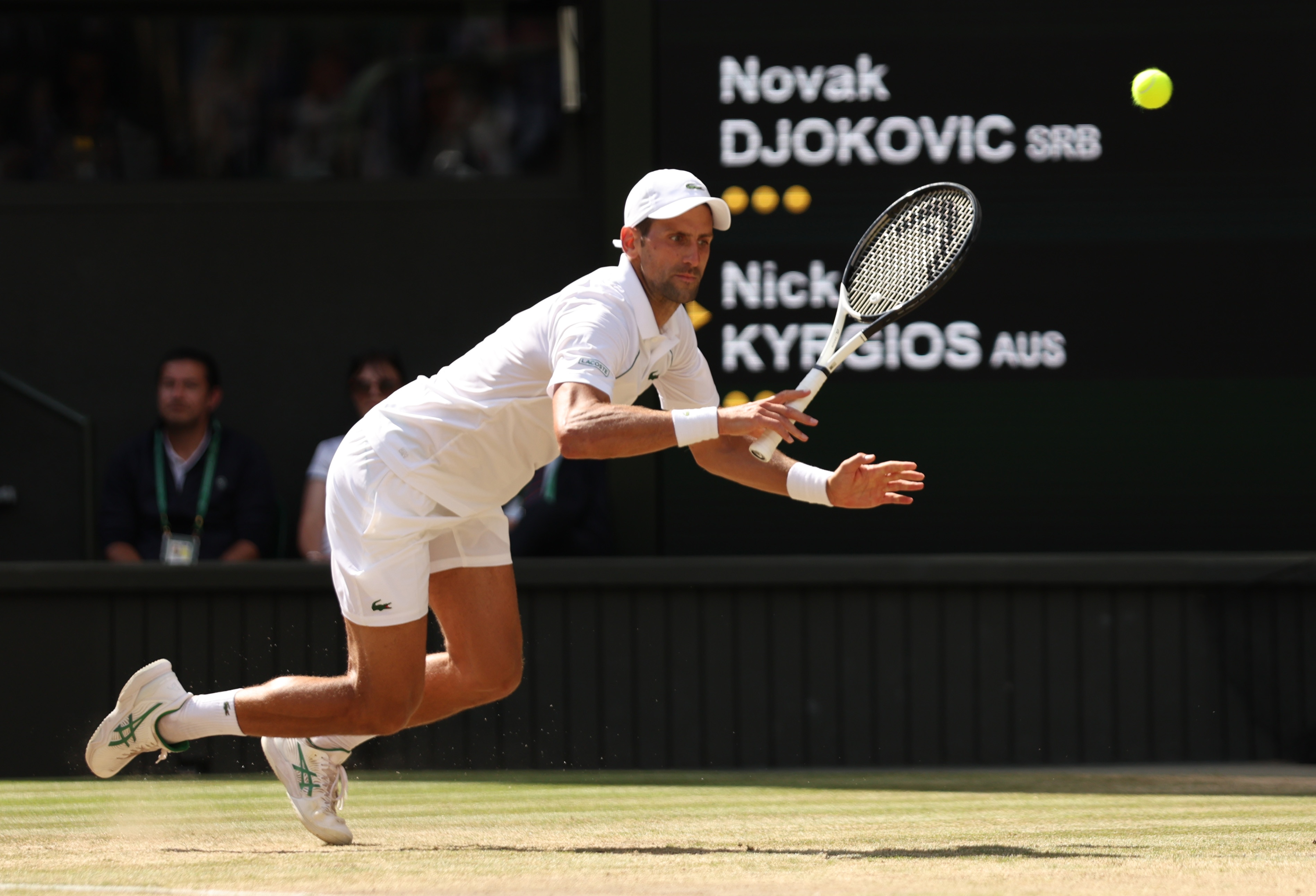 LONDON, ENGLAND - JULY 10: Novak Djokovic of Serbia falls against Nick Kyrgios of Australia during their Men's Singles Final match on day fourteen of The Championships Wimbledon 2022 at All England Lawn Tennis and Croquet Club on July 10, 2022 in London, England. (Photo by Clive Brunskill/Getty Images)