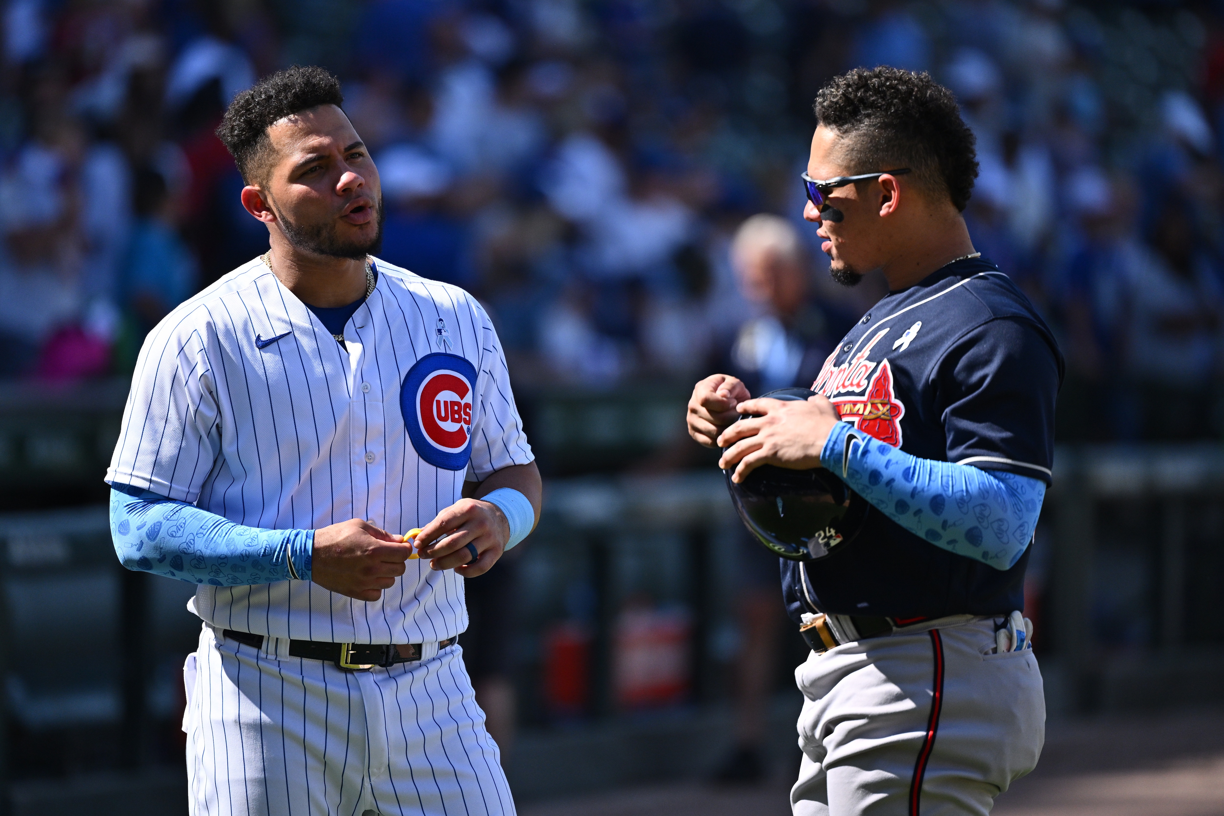 CHICAGO, IL - JUNE 19: Brothers Willson Contreras #40 of the Chicago Cubs and William Contreras #24 of the Atlanta Braves talk after their game at Wrigley Field on June 19, 2022 in Chicago, Illinois. Atlanta defeated Chicago 6-0. (Photo by Jamie Sabau/Getty Images)
