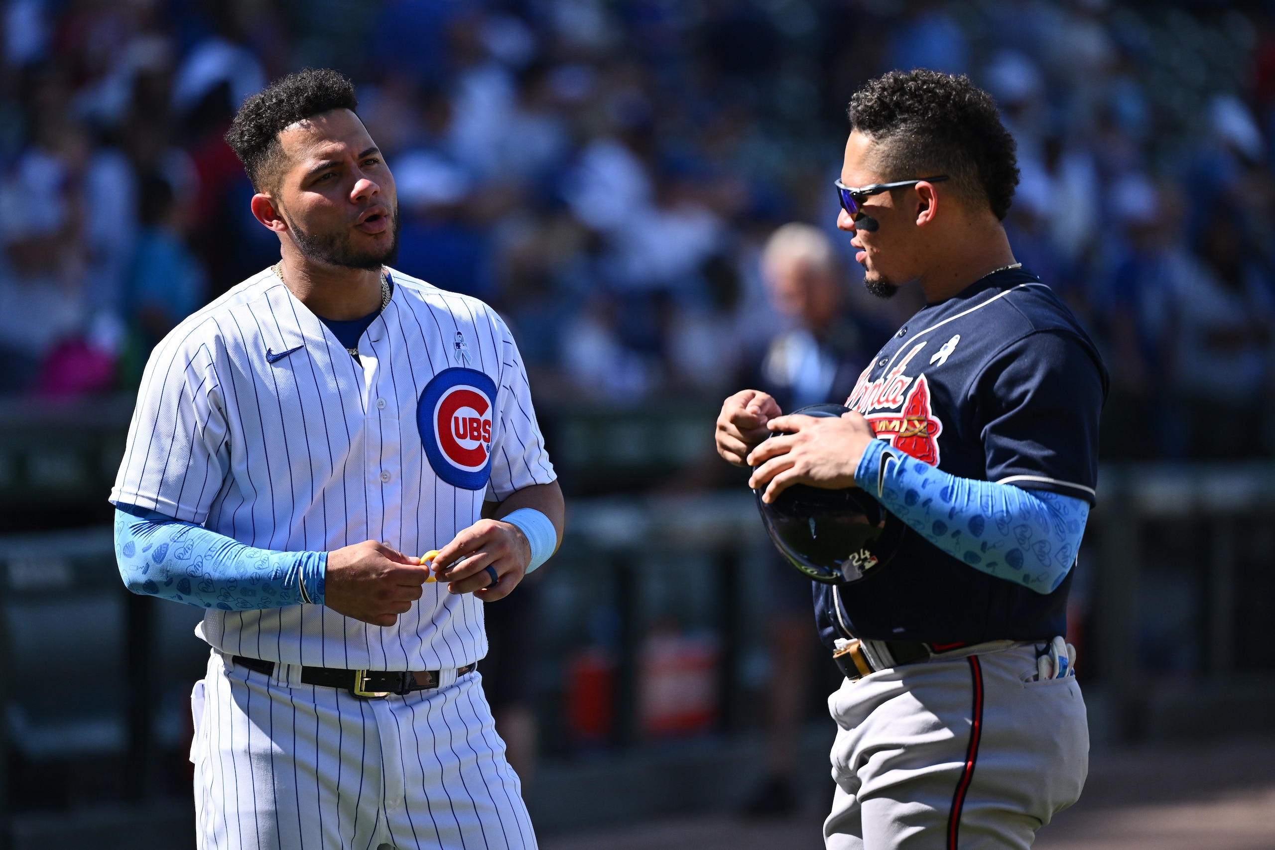 CHICAGO, IL - JUNE 19: Brothers Willson Contreras #40 of the Chicago Cubs and William Contreras #24 of the Atlanta Braves talk after their game at Wrigley Field on June 19, 2022 in Chicago, Illinois. Atlanta defeated Chicago 6-0. (Photo by Jamie Sabau/Getty Images)