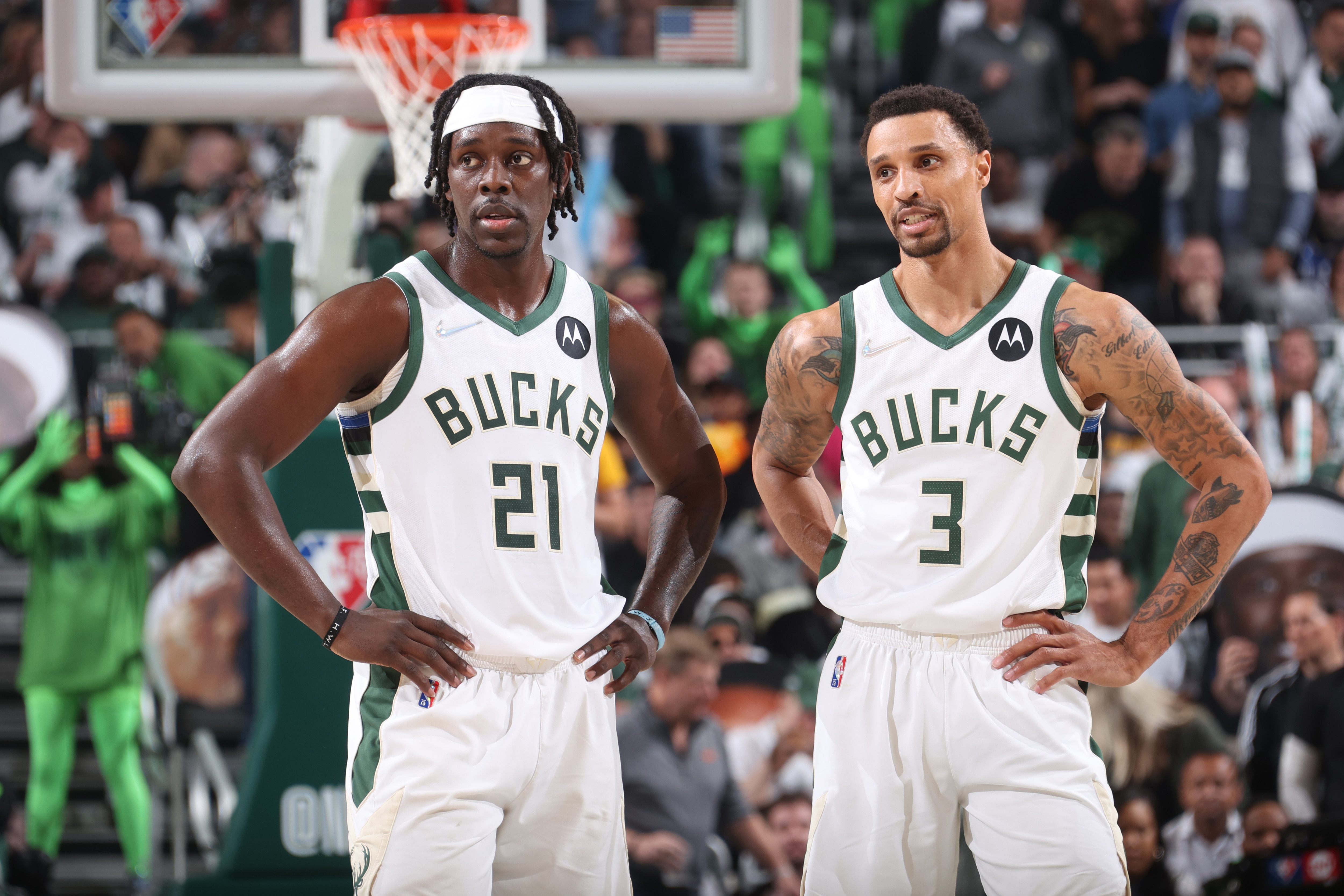 MILWAUKEE, WI - MAY 9: Jrue Holiday #21 of the Milwaukee Bucks and George Hill #3 of the Milwaukee Bucks look on during Game 4 of the 2022 NBA Playoffs Eastern Conference Semifinals on May 9, 2022 at the Fiserv Forum Center in Milwaukee, Wisconsin. NOTE TO USER: User expressly acknowledges and agrees that, by downloading and or using this Photograph, user is consenting to the terms and conditions of the Getty Images License Agreement. Mandatory Copyright Notice: Copyright 2022 NBAE (Photo by Nathaniel S. Butler/NBAE via Getty Images).