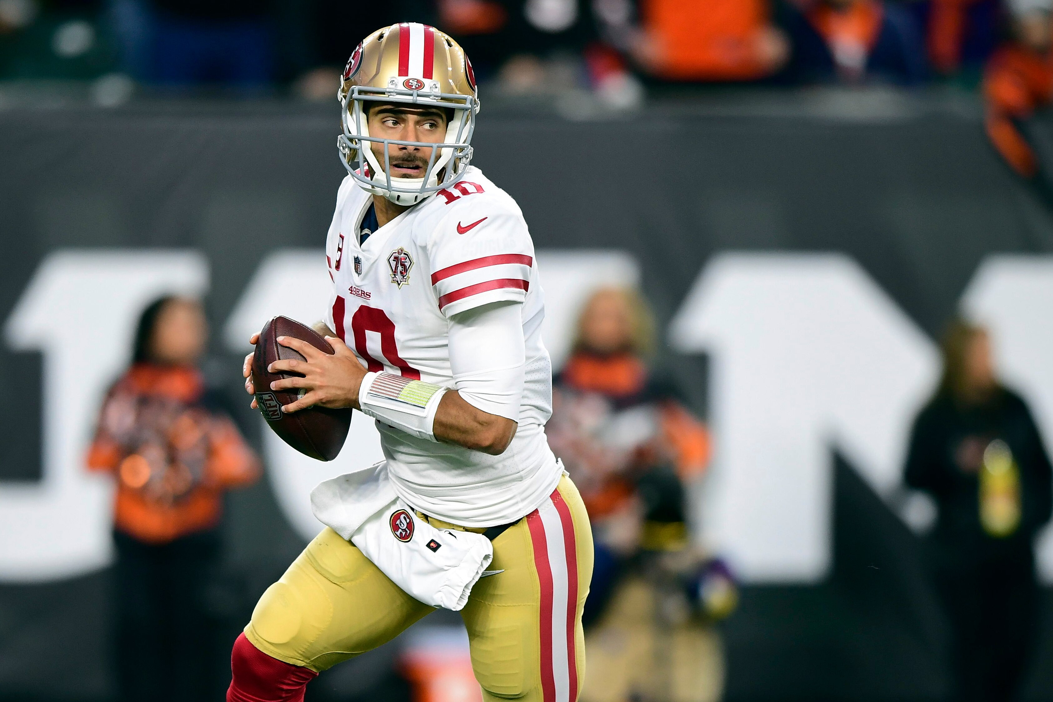 FILE - San Francisco 49ers quarterback Jimmy Garoppolo (10) drops back to pass during an NFL football game against the Cincinnati Bengals, on Dec. 12, 2021, in Cincinnati. From the potential move of Rodgers out of Green Bay to the likely departure of San Francisco's Jimmy Garoppolo despite the 49ers reaching another NFC championship game with him, trades are the talk of the QB market, not courtships. (AP Photo/Emilee Chinn, File)