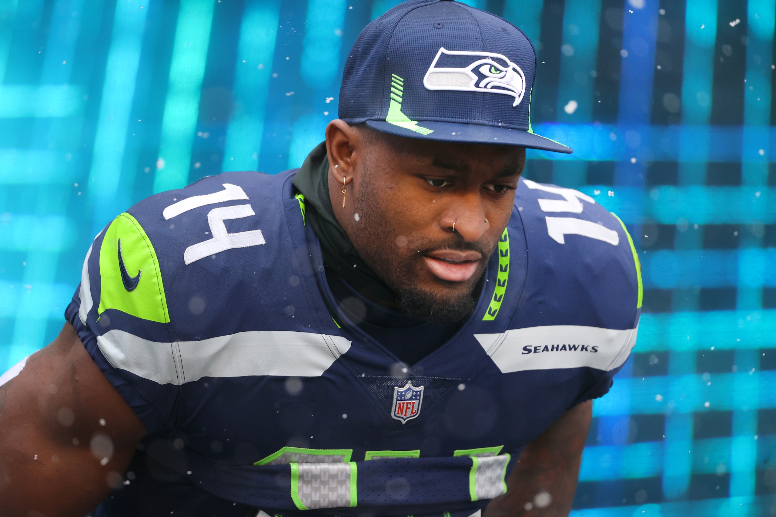 SEATTLE, WASHINGTON - DECEMBER 26: DK Metcalf #14 of the Seattle Seahawks takes the field before the game against the Chicago Bears at Lumen Field on December 26, 2021 in Seattle, Washington. (Photo by Abbie Parr/Getty Images) SEATTLE, WASHINGTON - DECEMBER 26: DK Metcalf #14 of the Seattle Seahawks takes the field before the game against the Chicago Bears at Lumen Field on December 26, 2021 in Seattle, Washington. (Photo by Abbie Parr/Getty Images)