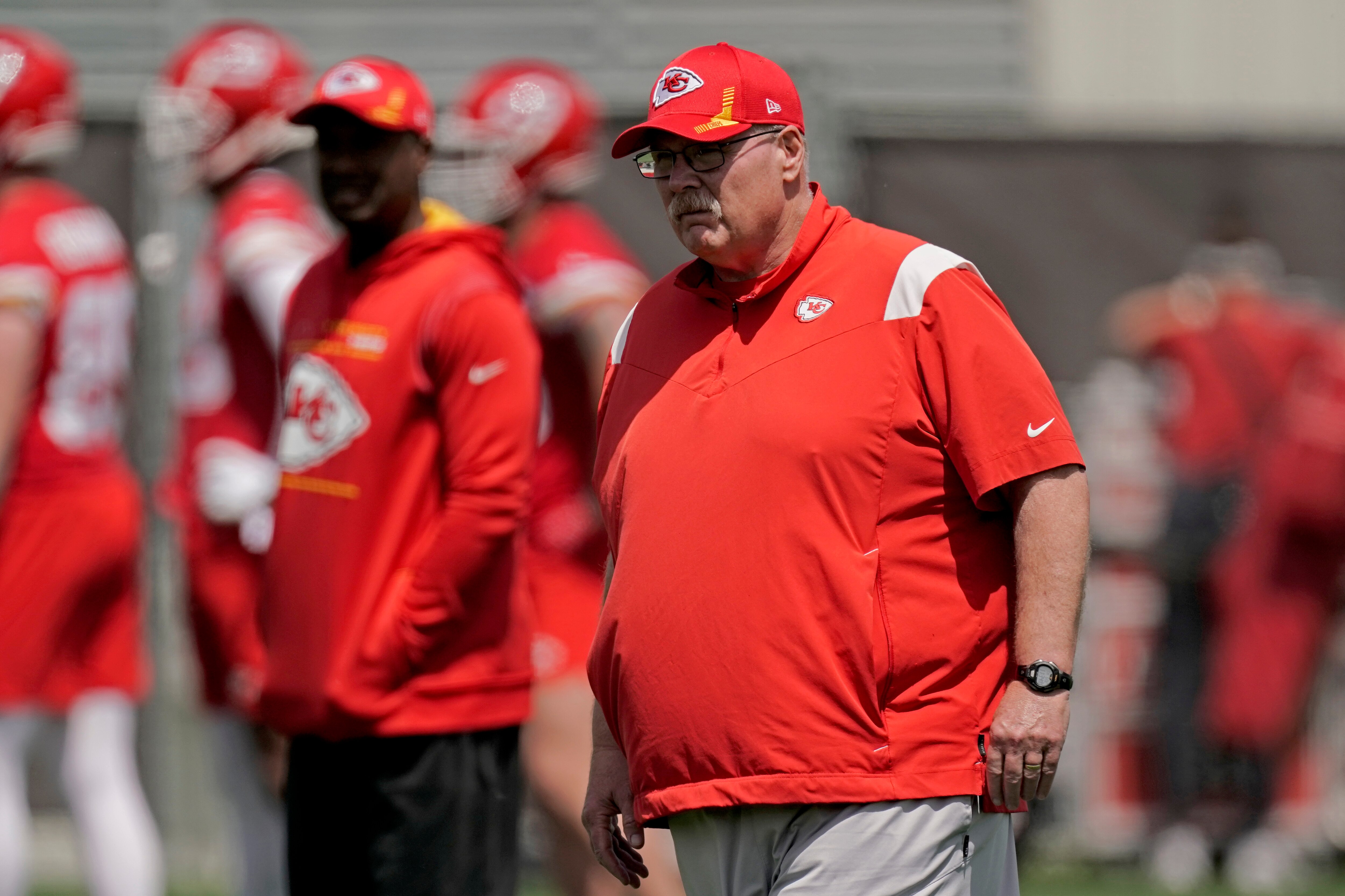Kansas City Chiefs head coach Andy Reid watches a drill during the NFL football team's organized team activities Thursday, June 2, 2022, in Kansas City, Mo. (AP Photo/Charlie Riedel)