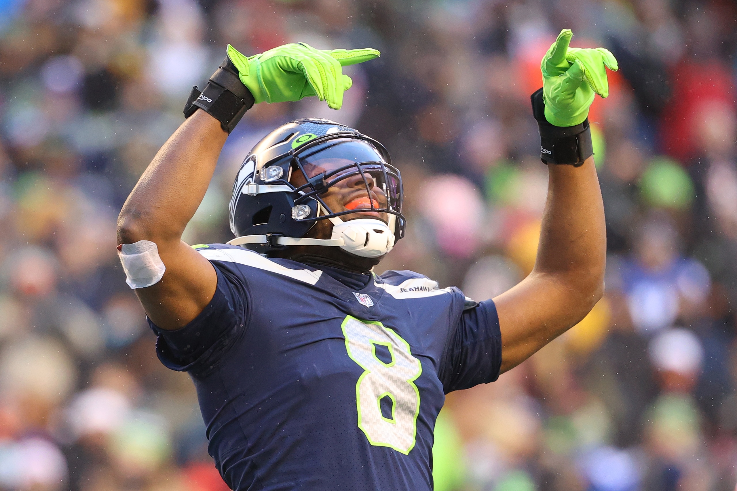 SEATTLE, WASHINGTON - DECEMBER 26: Carlos Dunlap #8 of the Seattle Seahawks reacts during the fourth quarter against the Chicago Bears at Lumen Field on December 26, 2021 in Seattle, Washington. (Photo by Abbie Parr/Getty Images)