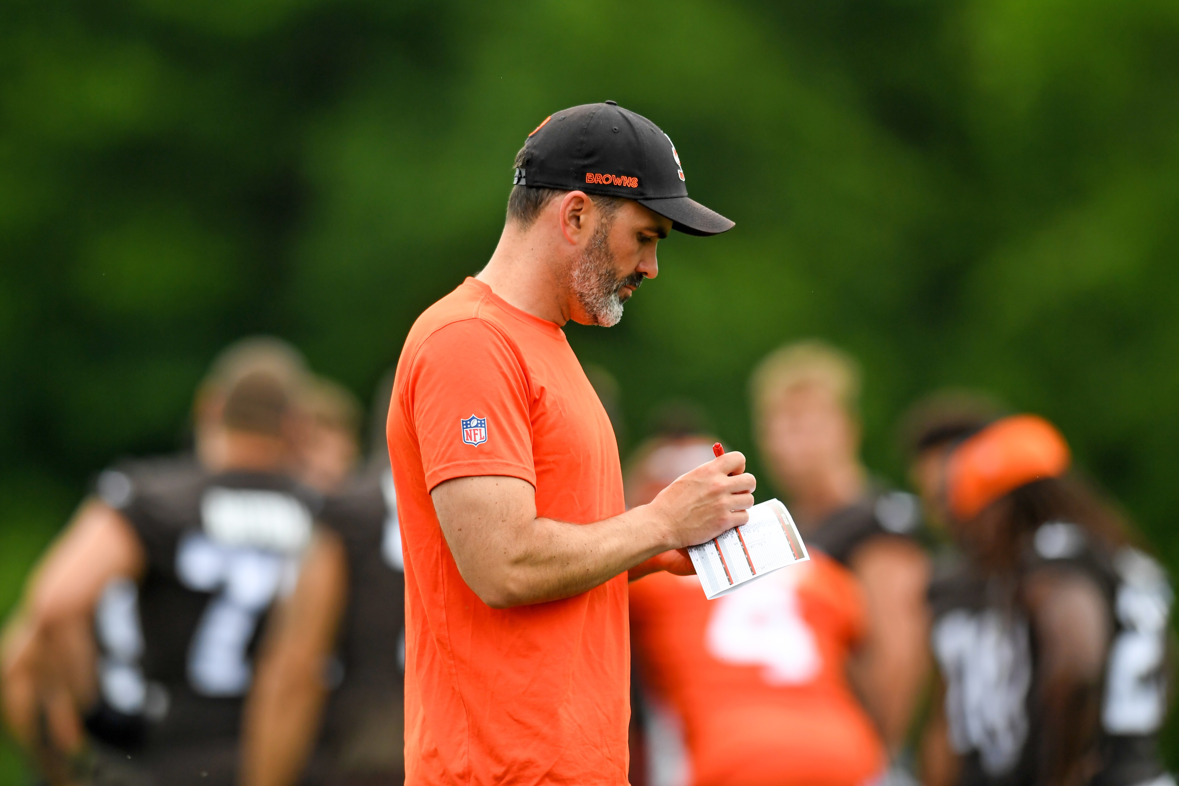 BEREA, OH - JUNE 14: Head coach Kevin Stefanski of the Cleveland Browns takes notes during the Cleveland Browns mandatory minicamp at CrossCountry Mortgage Campus on June 14, 2022 in Berea, Ohio. (Photo by Nick Cammett/Diamond Images via Getty Images)
