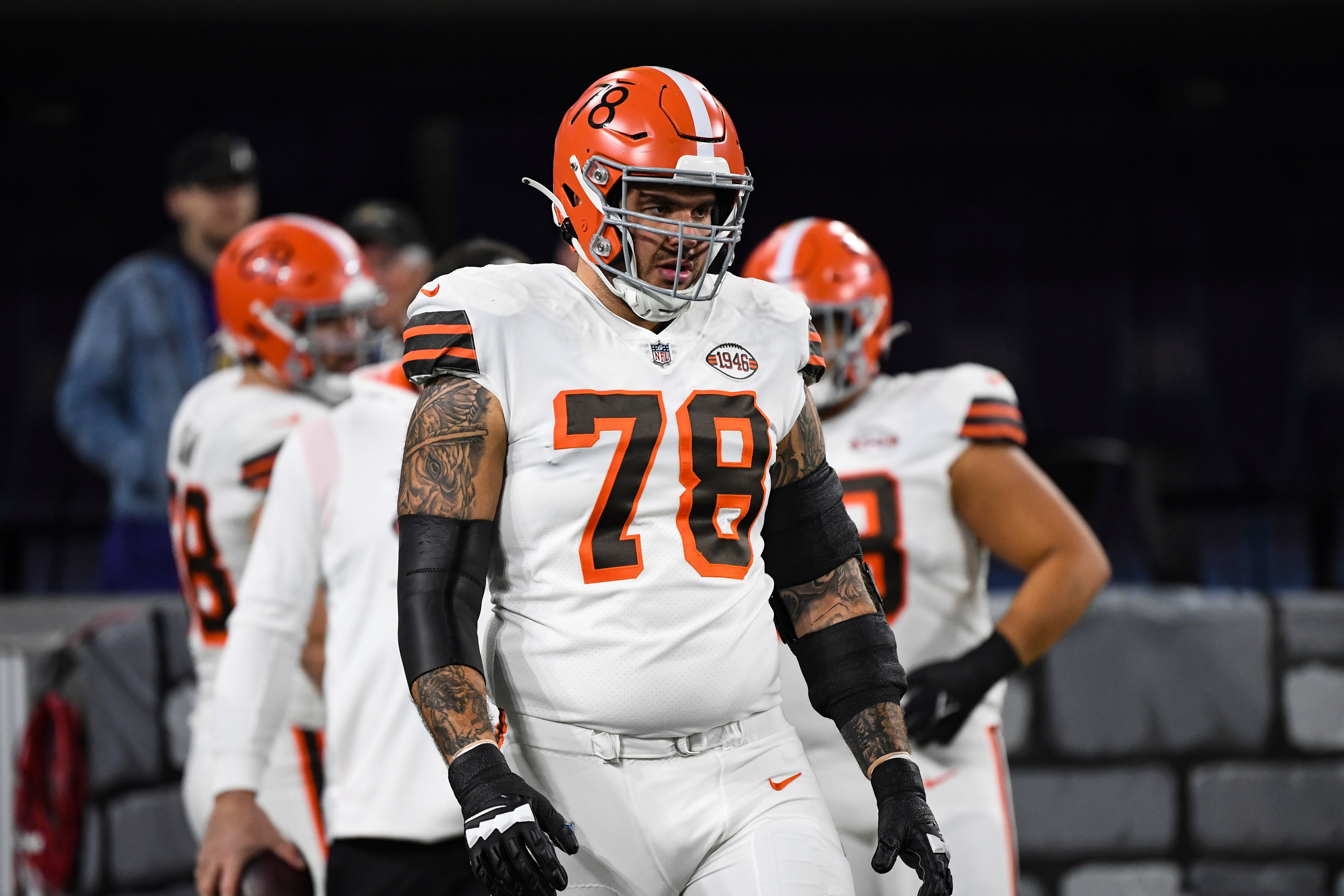 Cleveland Browns offensive tackle Jack Conklin (78) looks on during pre-game warm-ups before an NFL football game against the Baltimore Ravens, Sunday, Nov. 28, 2021, in Baltimore. (AP Photo/Terrance Williams)