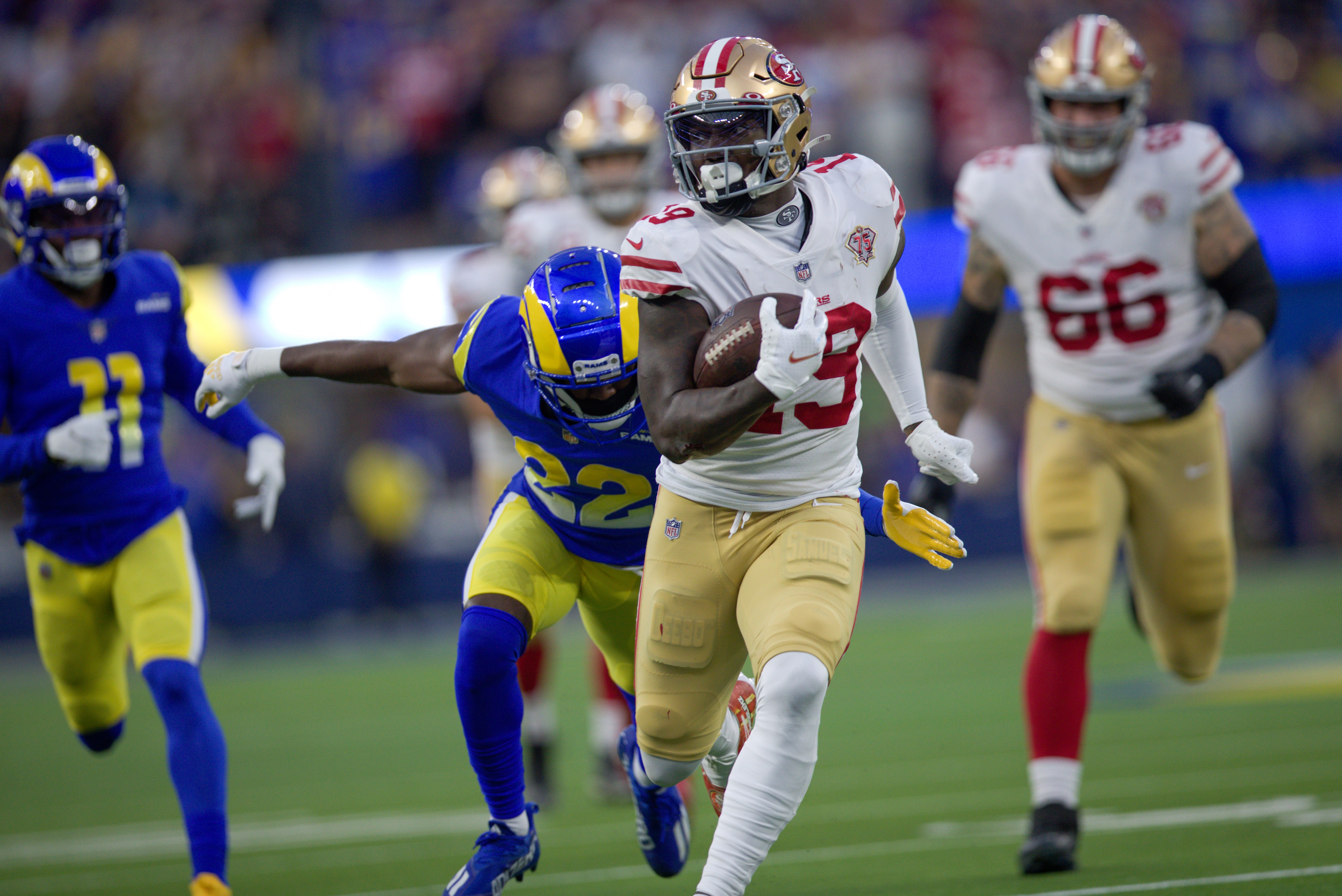 INGLEWOOD, CA - JANUARY 30: Deebo Samuel #19 of the San Francisco 49ers heads to the end zone on a 44-yard touchdown catch during the game against the Los Angeles Rams at SoFi Stadium on January 30, 2022 in Inglewood, California. The Rams defeated the 49ers 20-17. (Photo by Michael Zagaris/San Francisco 49ers/Getty Images)