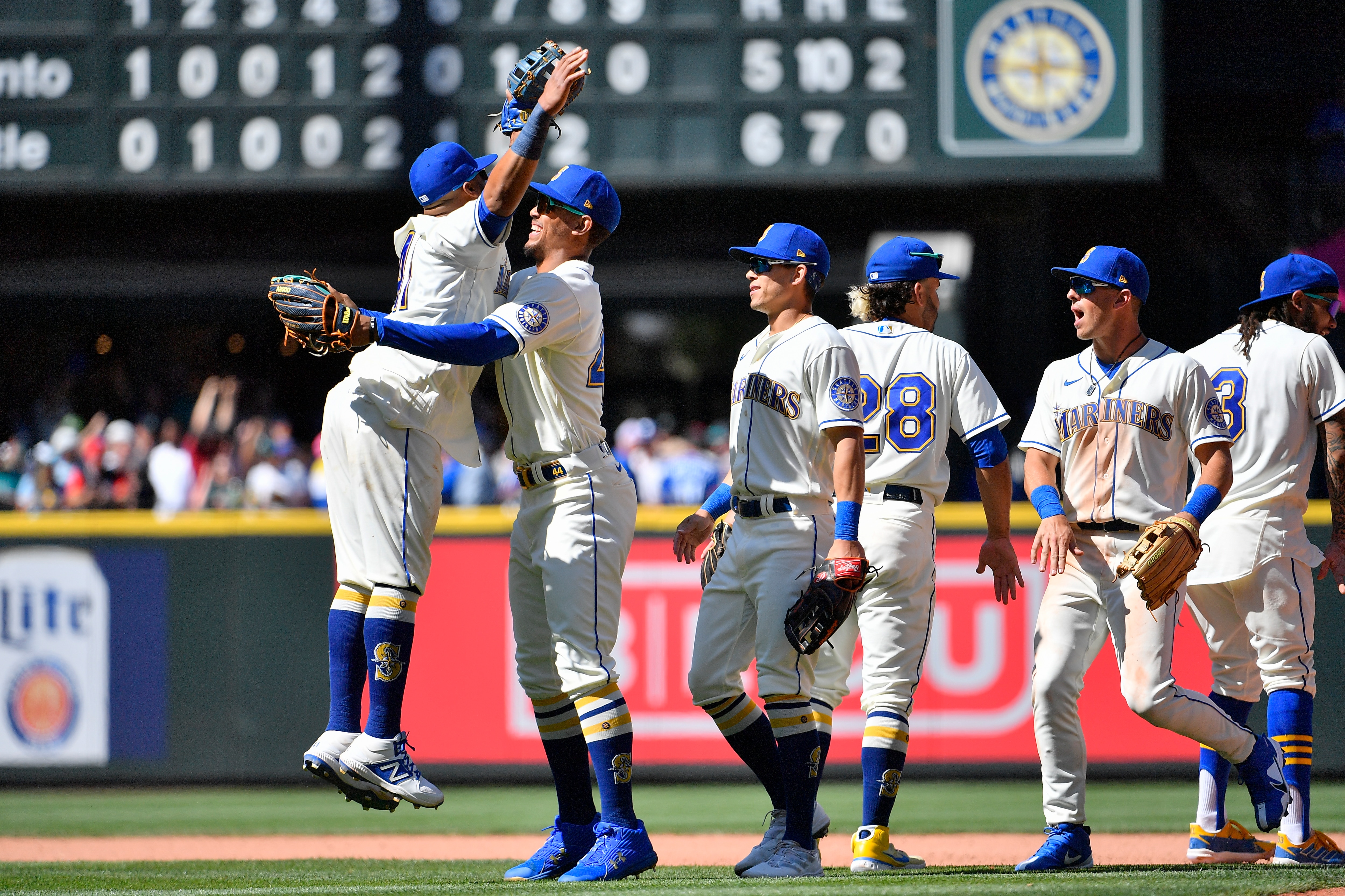 SEATTLE, WASHINGTON - JULY 10: Julio Rodriguez #44, Carlos Santana #41, Sam Haggerty #0, Eugenio Suarez #28, Adam Frazier #26, and J.P. Crawford #3 of the Seattle Mariners celebrate after the game against the Toronto Blue Jaysat T-Mobile Park on July 10, 2022 in Seattle, Washington. The Seattle Mariners won 6-5. (Photo by Alika Jenner/Getty Images)