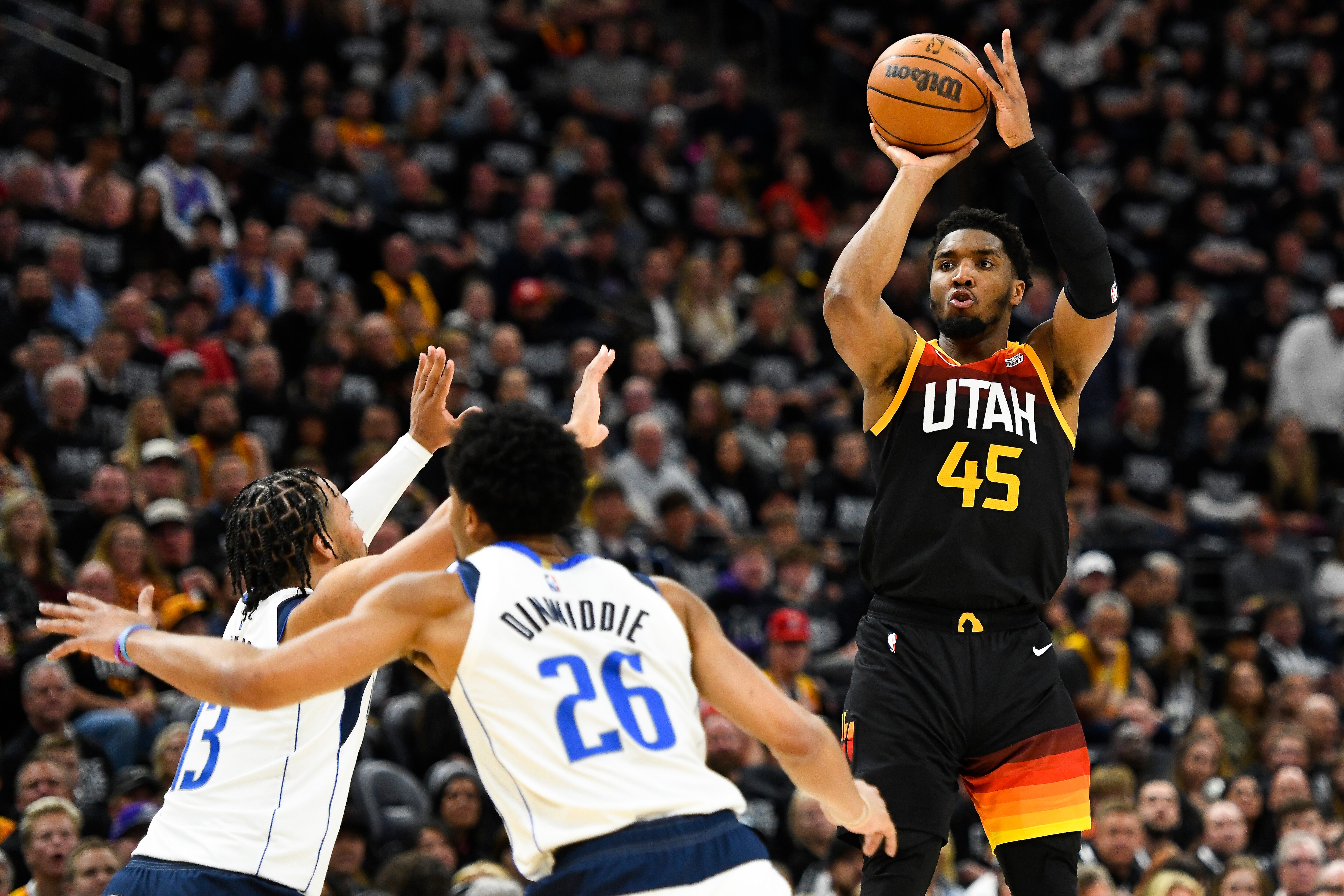 SALT LAKE CITY, UTAH - APRIL 28: Donovan Mitchell #45 of the Utah Jazz shoots over Jalen Brunson #13 of the Dallas Mavericks during the second half of Game 6 of the Western Conference First Round Playoffs at Vivint Smart Home Arena on April 28, 2022 in Salt Lake City, Utah. NOTE TO USER: User expressly acknowledges and agrees that, by downloading and/or using this Photograph, user is consenting to the terms and conditions of the Getty Images License Agreement. (Photo by Alex Goodlett/Getty Images)