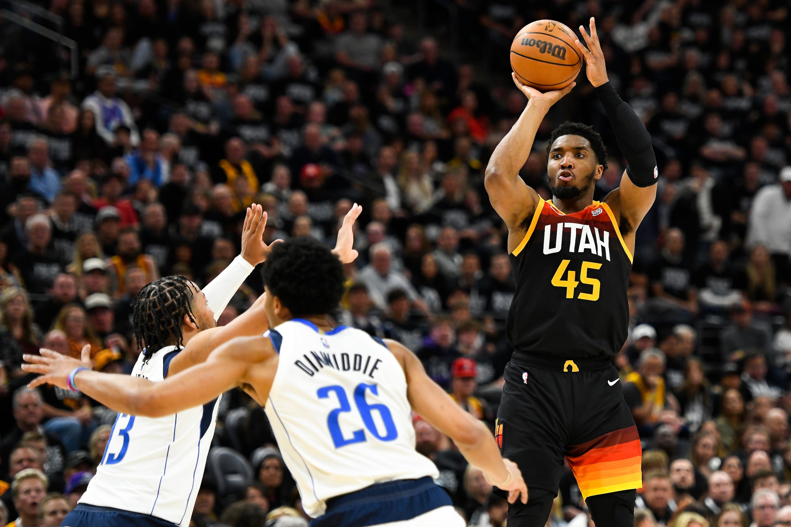 SALT LAKE CITY, UTAH - APRIL 28: Donovan Mitchell #45 of the Utah Jazz shoots over Jalen Brunson #13 of the Dallas Mavericks during the second half of Game 6 of the Western Conference First Round Playoffs at Vivint Smart Home Arena on April 28, 2022 in Salt Lake City, Utah. NOTE TO USER: User expressly acknowledges and agrees that, by downloading and/or using this Photograph, user is consenting to the terms and conditions of the Getty Images License Agreement. (Photo by Alex Goodlett/Getty Images)