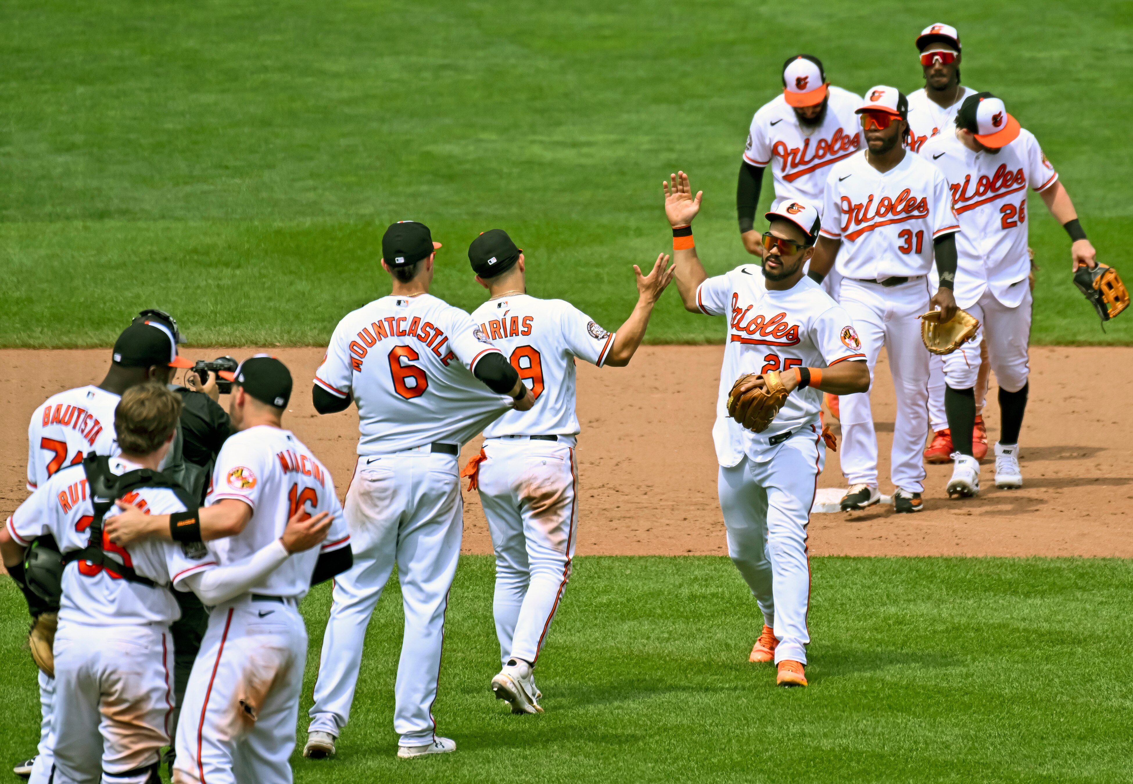 BALTIMORE, MD - JULY 10: Baltimore Orioles right fielder Anthony Santander (25) celebrates with second baseman Ramon Urias (29) following the Los Angeles Angels game versus the Baltimore Orioles on July 10, 2022 at Orioles Park at Camden Yards, in Baltimore, MD.  (Photo by Mark Goldman/Icon Sportswire via Getty Images)