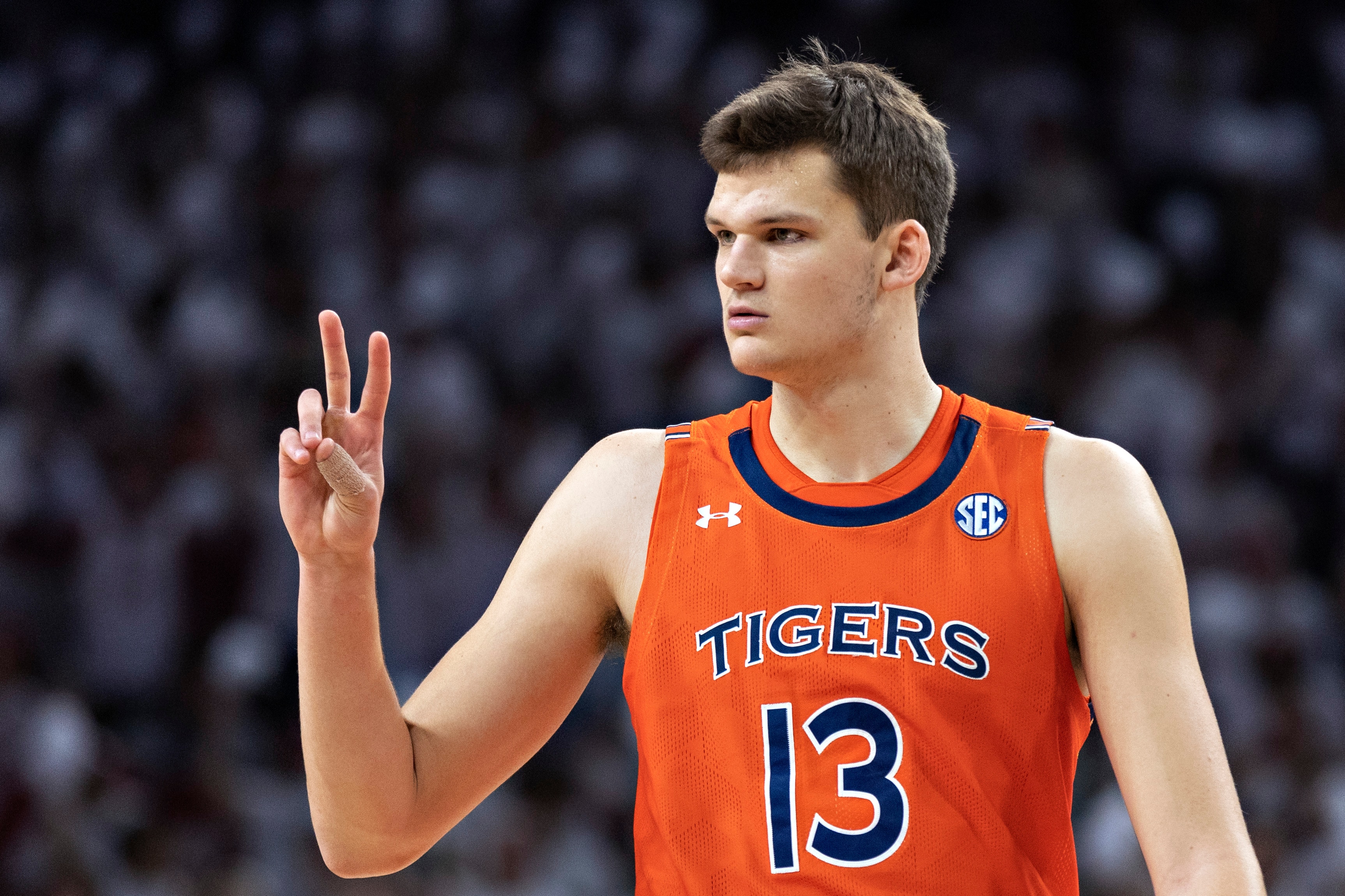 FAYETTEVILLE, ARKANSAS - FEBRUARY 08: Walker Kessler #13 of the Auburn Tigers signals to the bench during a game against the Arkansas Razorbacks at Bud Walton Arena on February 08, 2022 in Fayetteville, Arkansas. The Razorbacks defeated the Tigers 80-76. (Photo by Wesley Hitt/Getty Images)
