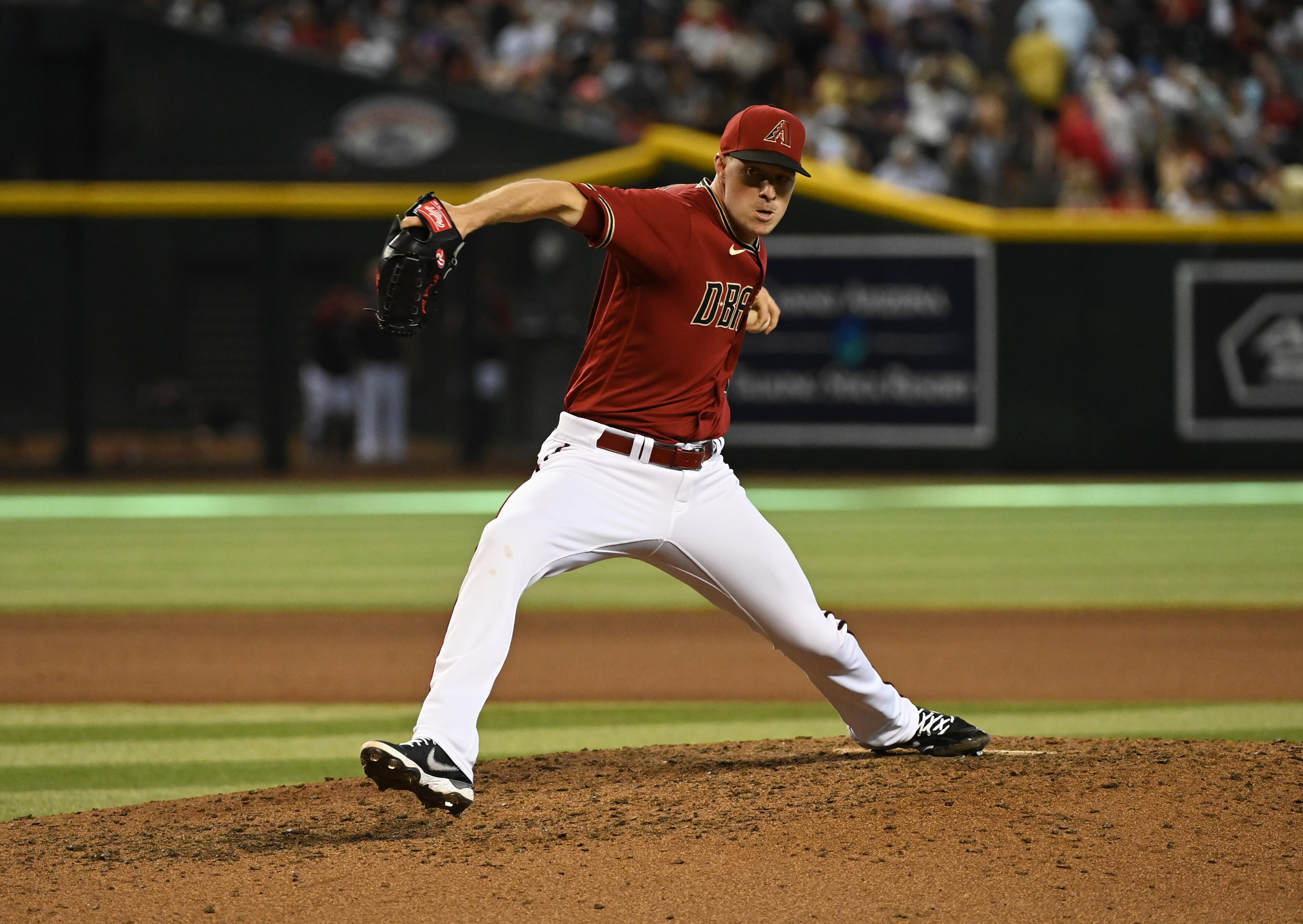 PHOENIX, ARIZONA - JULY 10: Joe Mantiply #35 of the Arizona Diamondbacks delivers an eighth inning pitch against the Colorado Rockies at Chase Field on July 10, 2022 in Phoenix, Arizona. (Photo by Norm Hall/Getty Images)