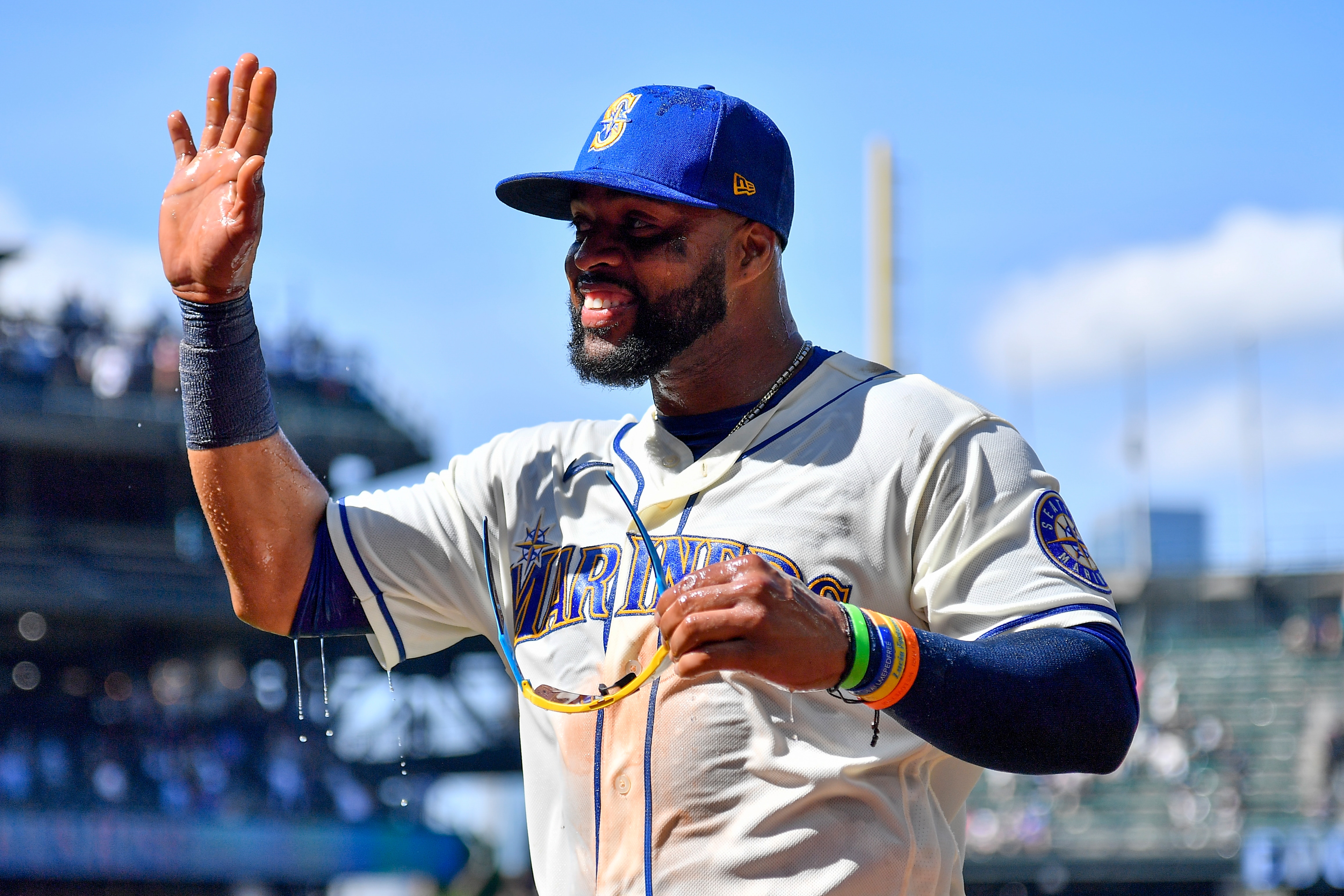 SEATTLE, WASHINGTON - JULY 10: Carlos Santana #41 of the Seattle Mariners waves after a post game Gatorade shower against the Toronto Blue Jays at T-Mobile Park on July 10, 2022 in Seattle, Washington. The Seattle Mariners won 6-5. (Photo by Alika Jenner/Getty Images)