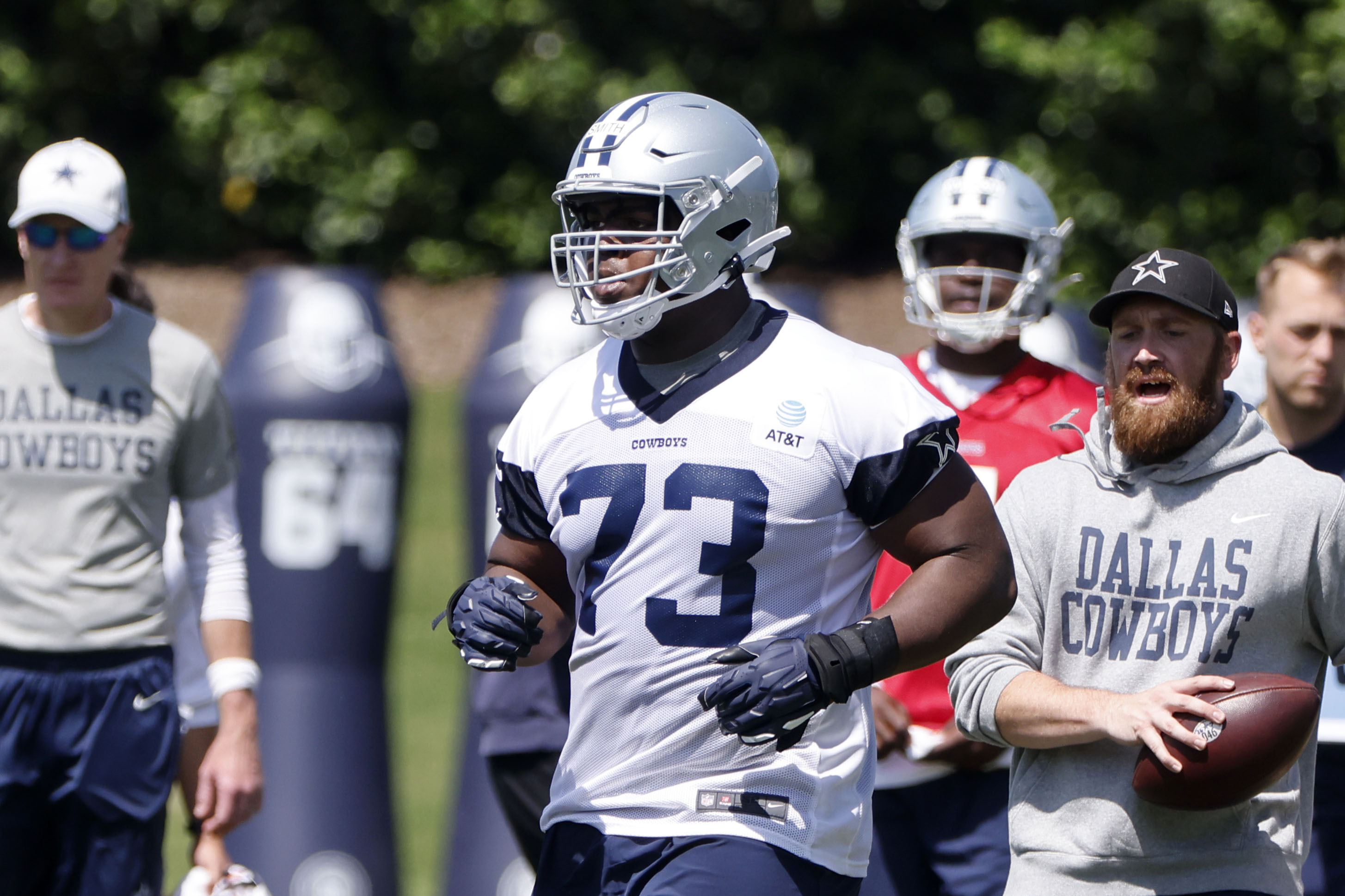Dallas Cowboys offensive lineman Tyler Smith (73) jogs to the next drill during the NFL football team's rookie minicamp in Frisco, Texas, Friday, May 13, 2022. (AP Photo/Michael Ainsworth)