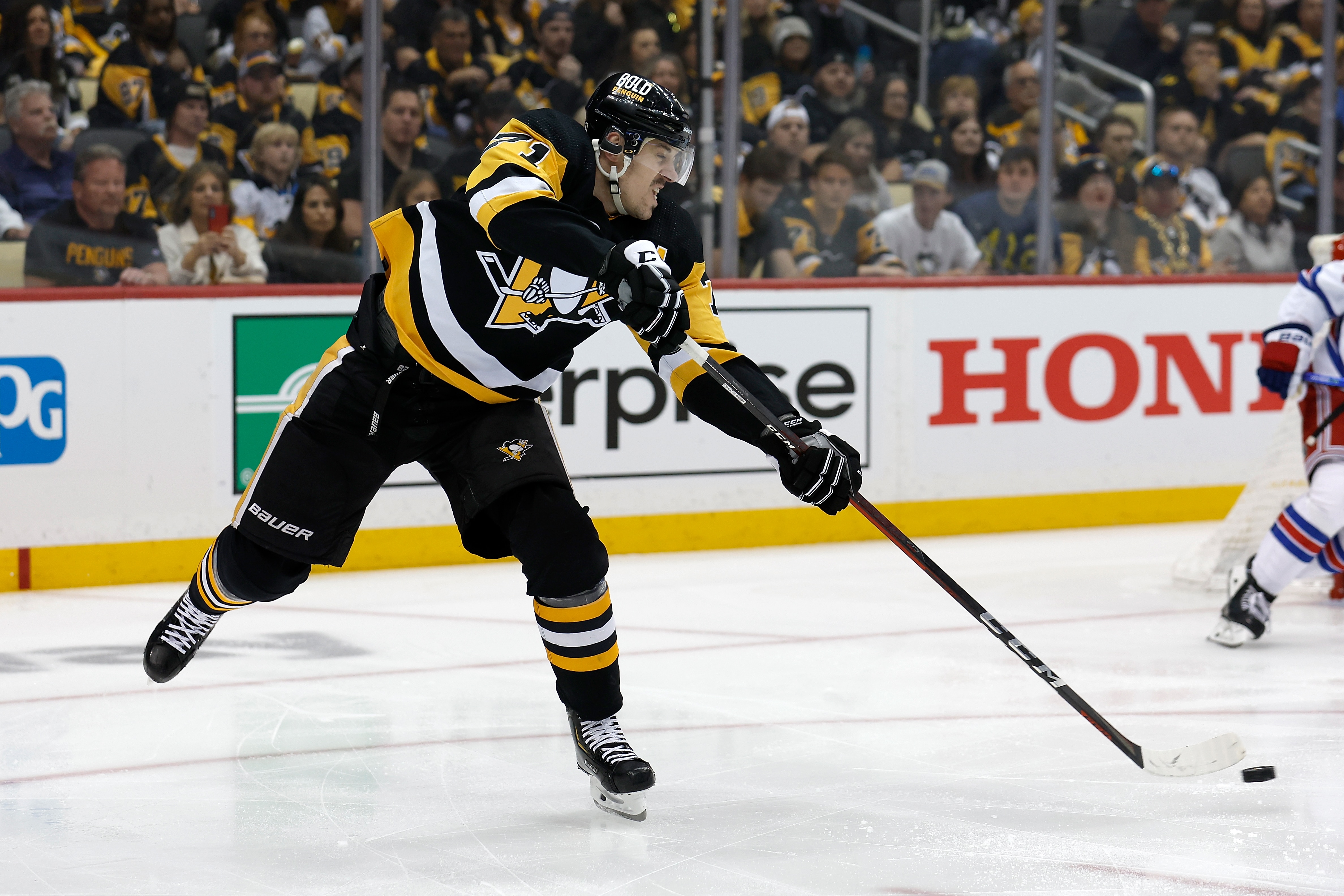 PITTSBURGH, PA - MAY 13:  Evgeni Malkin #71 of the Pittsburgh Penguins passes the puck in Game Six of the First Round of the 2022 Stanley Cup Playoffs against the New York Rangers at PPG PAINTS Arena on May 13, 2022 in Pittsburgh, Pennsylvania. (Photo by Kirk Irwin/Getty Images)